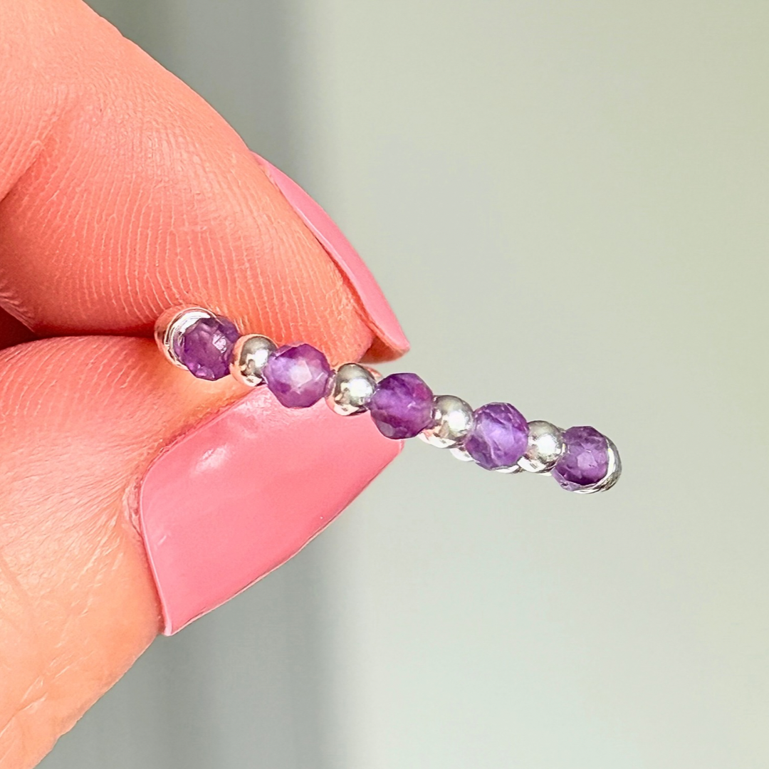 Sterling silver amethyst ring featuring five 3mm faceted round amethyst beads on a elasticated ring band of 2.5mm sterling silver beads. February birthstone ring.