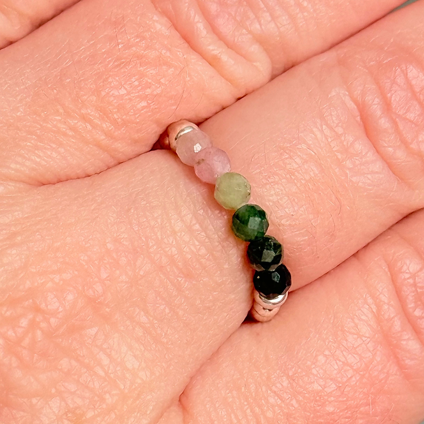 Sterling silver band style ring with multicolour 3mm faceted mixed tourmaline beads in shades of pink, green and black with a beaded band of 2.5 mm sterling silver round . Elasticated for comfort.