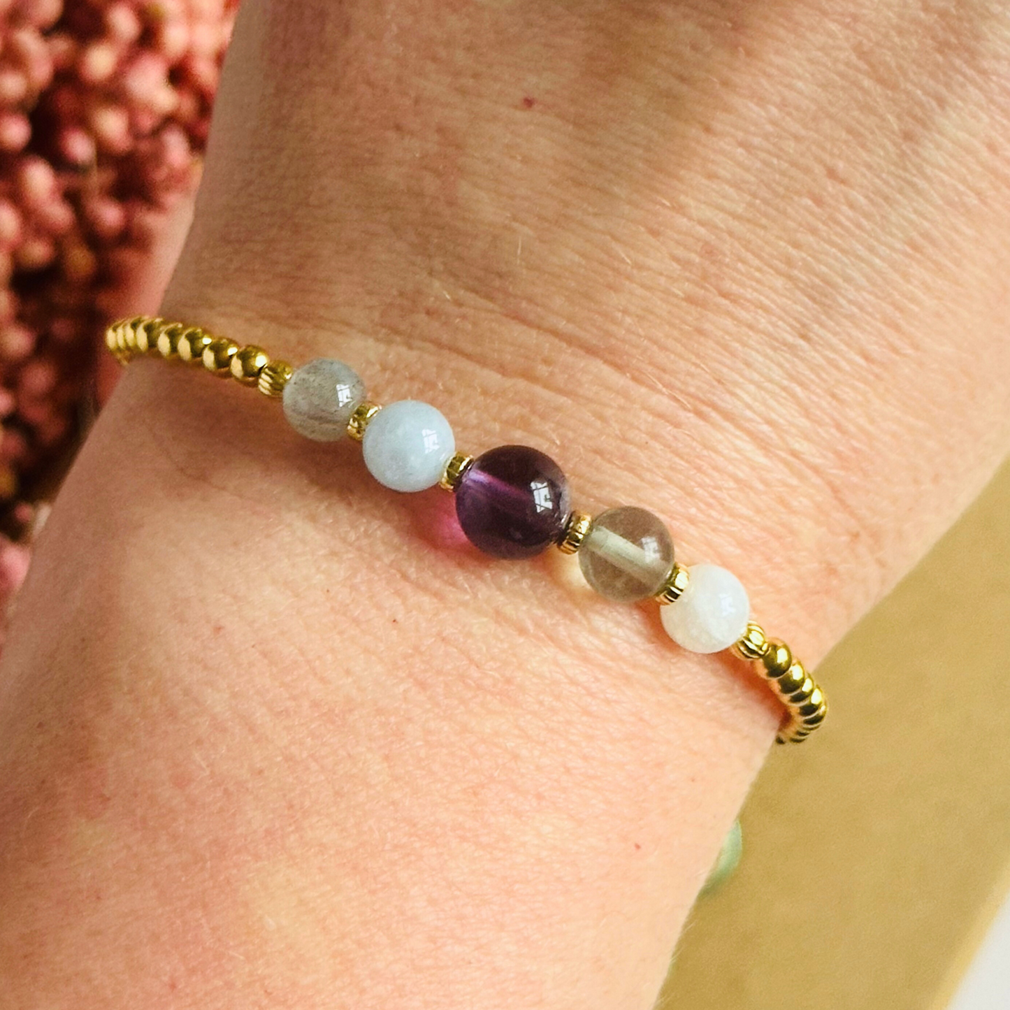 This gold vermeil Aquarius bracelet is made with a selection of five healing crystals all believed to resonate with the Aquarius zodiac sign. The central bead is 8mm, the other four are 6mm. On an elasticated band of 3mm gold vermeil beads with corrugated accent beads. Featuring labradorite, moonstone, fluorite, amethyst and aquamarine.