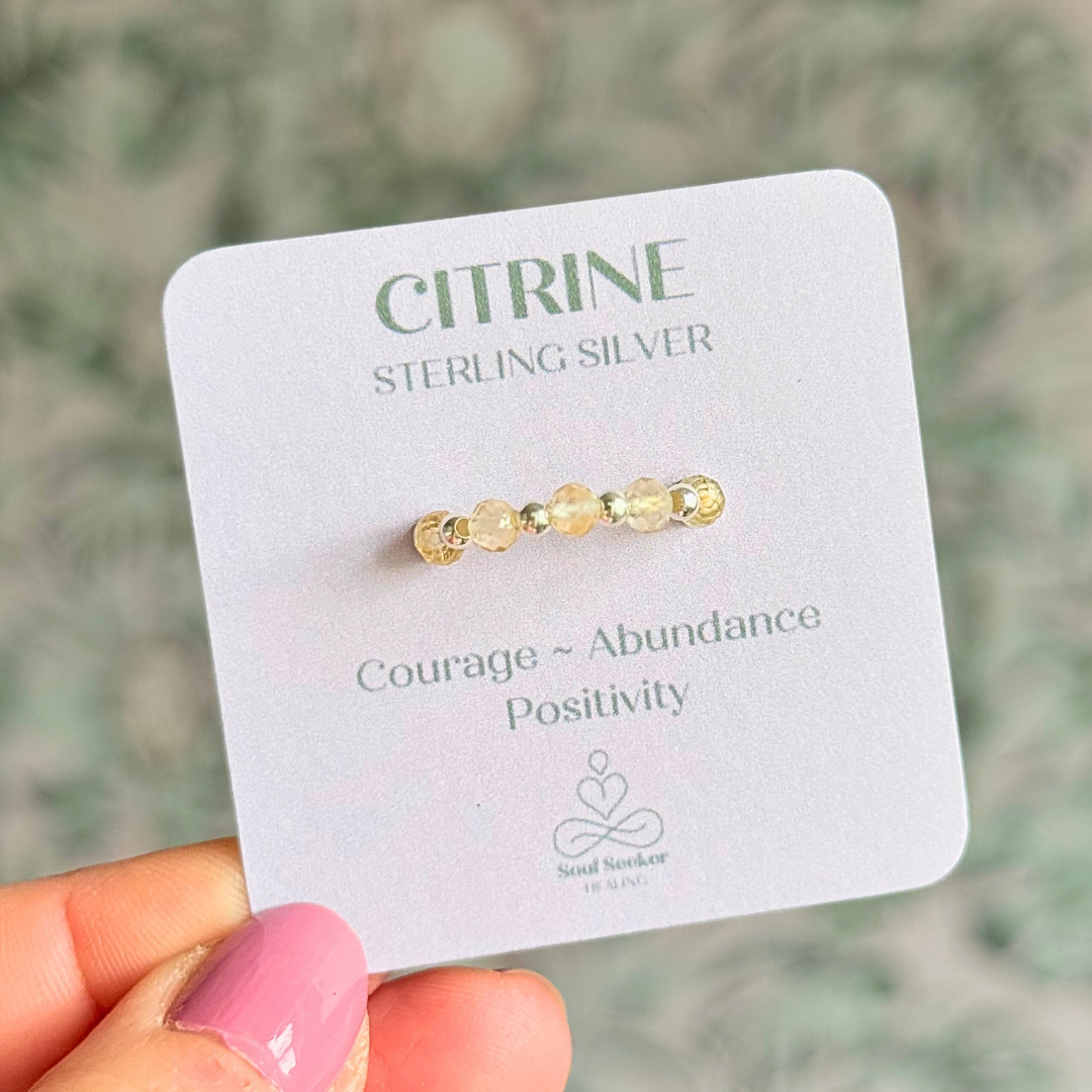 Sterling silver and citrine crystal ring. Made with 2.5mm sterling silver round beads and featuring five, 3mm faceted genuine citrine beads in a band style. Perfect for stacking. November birthstone jewellery