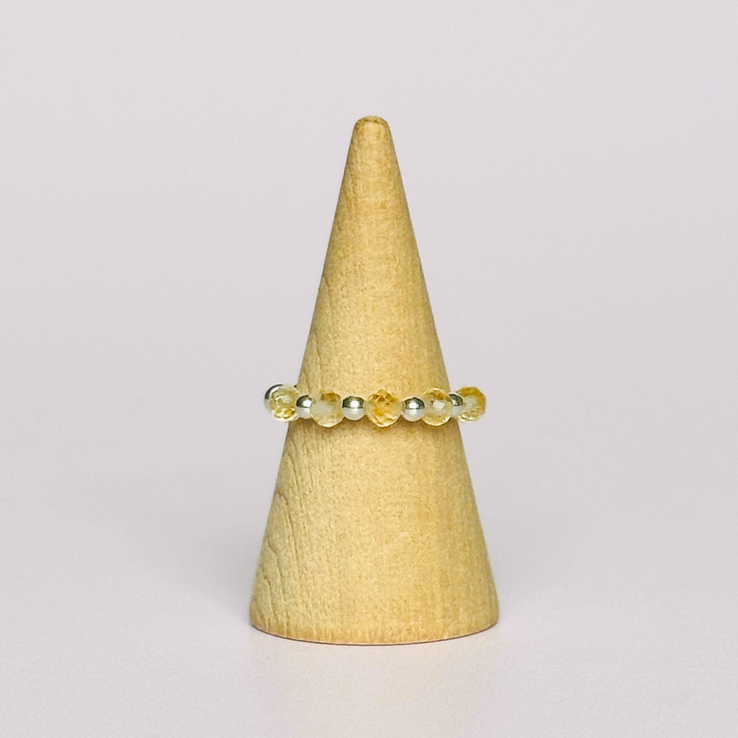 Citrine ring featuring five faceted 3mm citrine beads on a sterling silver elasticated band. November birthday ideas, November birthday gift, November birthstone ring, stretch ring, November jewellery, born in November, November woman