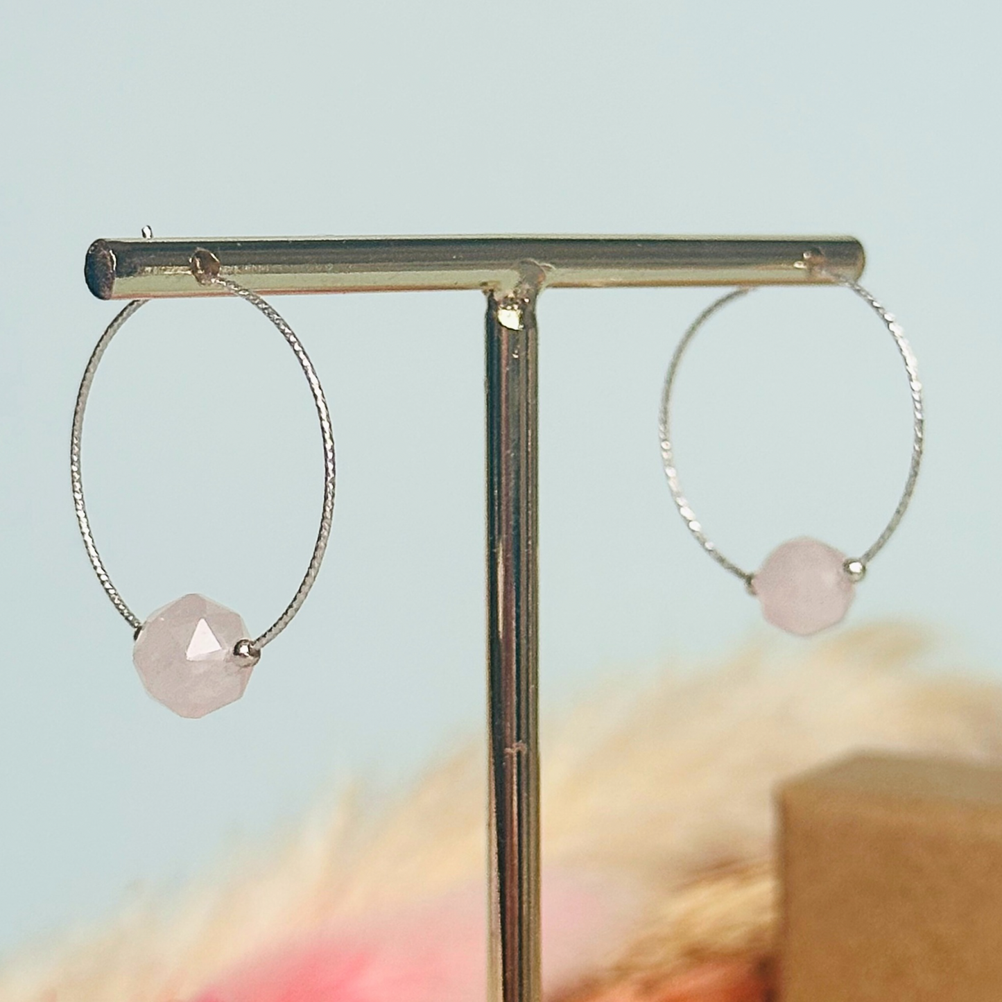 Rose Quartz sterling silver hoop earrings featuring 8mm star cut rose quartz beads on 25mm sparkle cut sterling silver hoops.