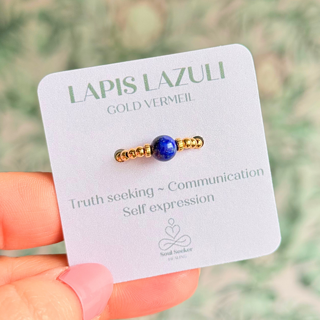 Gold vermeil beaded ring featuring a 6mm lapis lazuli round bead, flanked by gold vermeil corrugated beads. Elasticated for comfort.