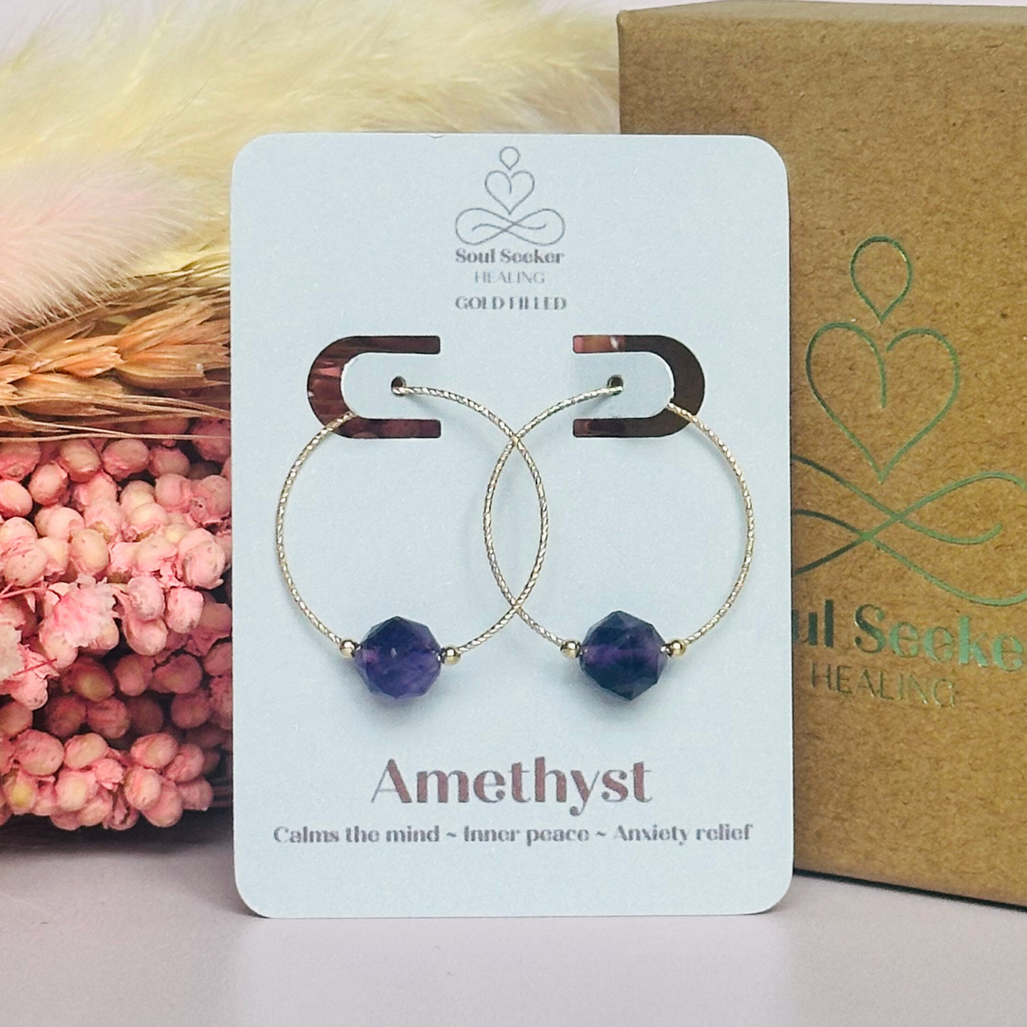 Amethyst gold filled hoop earrings featuring 8mm star cut amethyst beads on 25mm sparkle cut gold filled hoops.