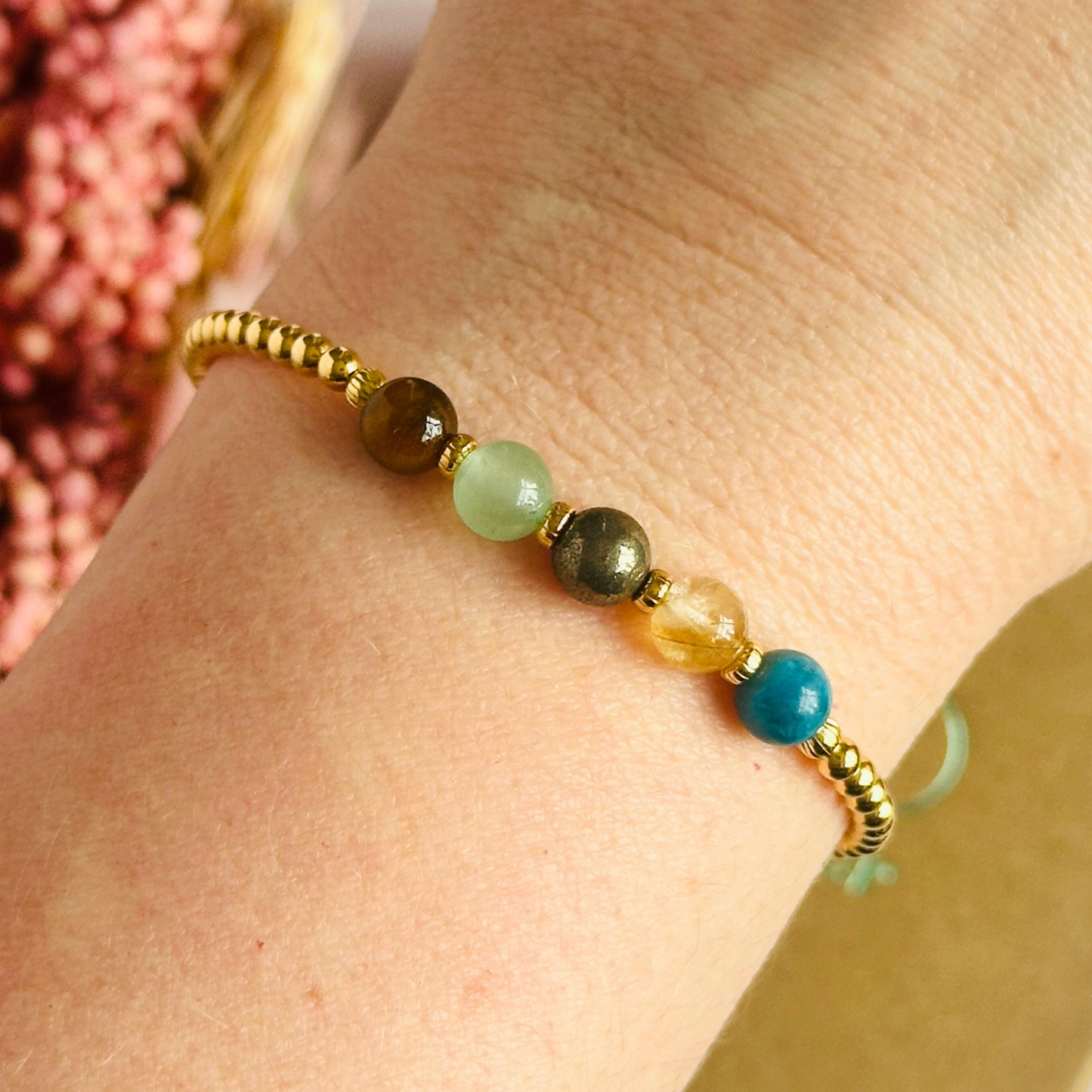 This gold vermeil manifesting bracelet is made with a selection of five healing crystals all believed to help achieve your dream life. The crystal beads are all 6mm and are on a band of 3mm gold vermeil beads with corrugated accent beads.