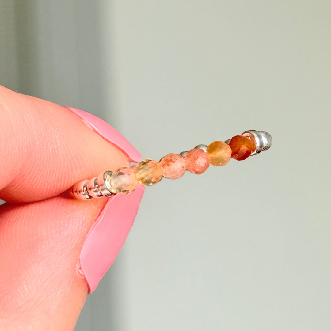 Sterling silver band style ombré ring with multicolour gradient 3mm faceted citrine, sunstone and carnelian beads with a beaded band of 2.5 mm sterling silver round beads. Elasticated for comfort.