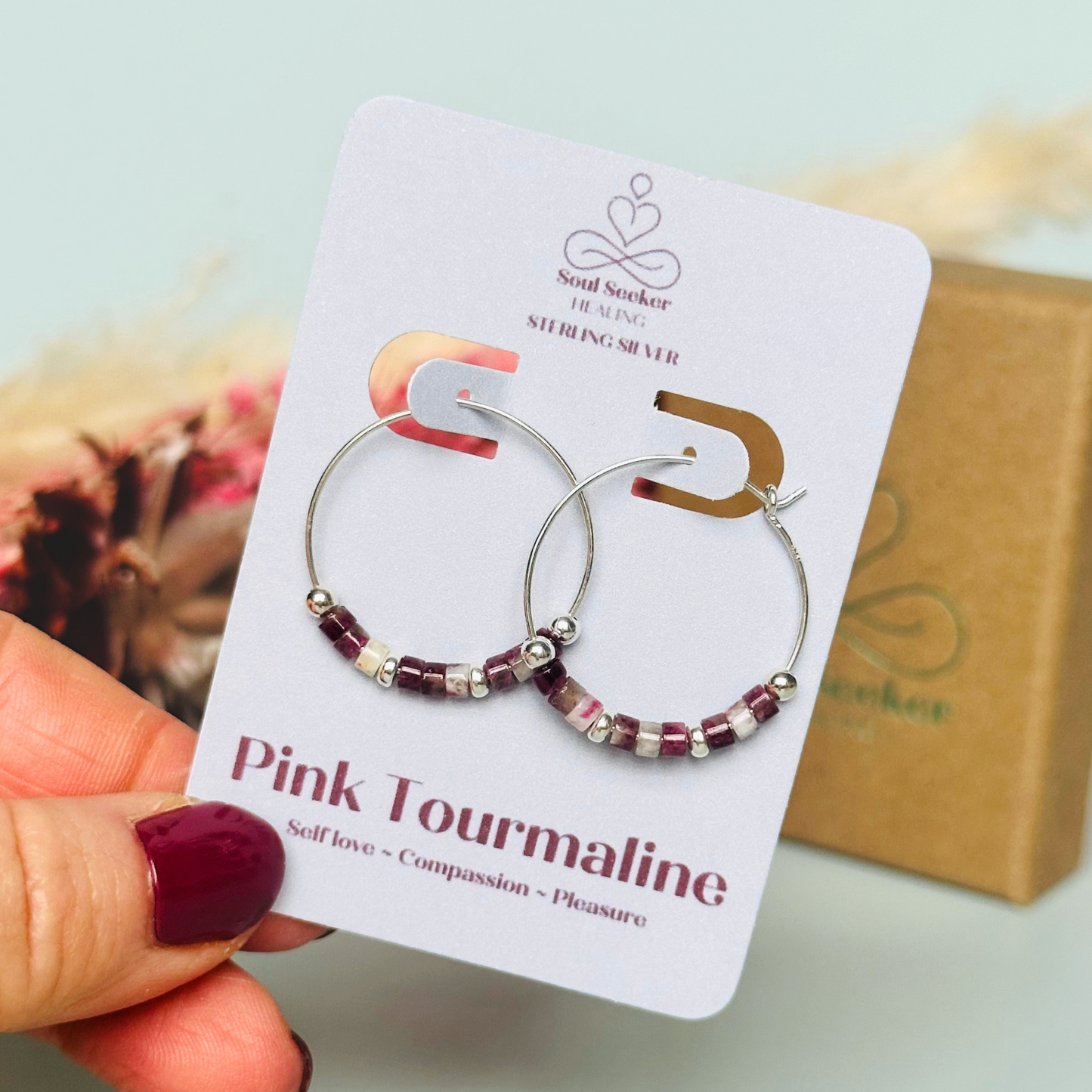 Pink tourmaline sterling silver hoop earrings made with pink tourmaline heishi beads on 25mm sterling silver hoops.
