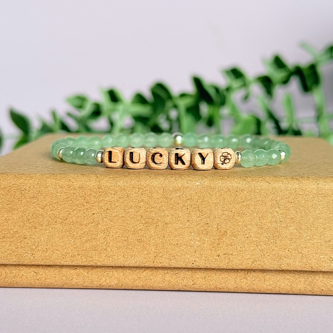 Bracelet featuring 5mm engraved wooden beads which you can personalise with your choice of words, numbers and symbols. The main the band of the bracelet is made with 4mm faceted green aventurine round crystal gemstone beads. Finished with your choice of gold vermeil, sterling silver or rose gold vermeil accent beads.