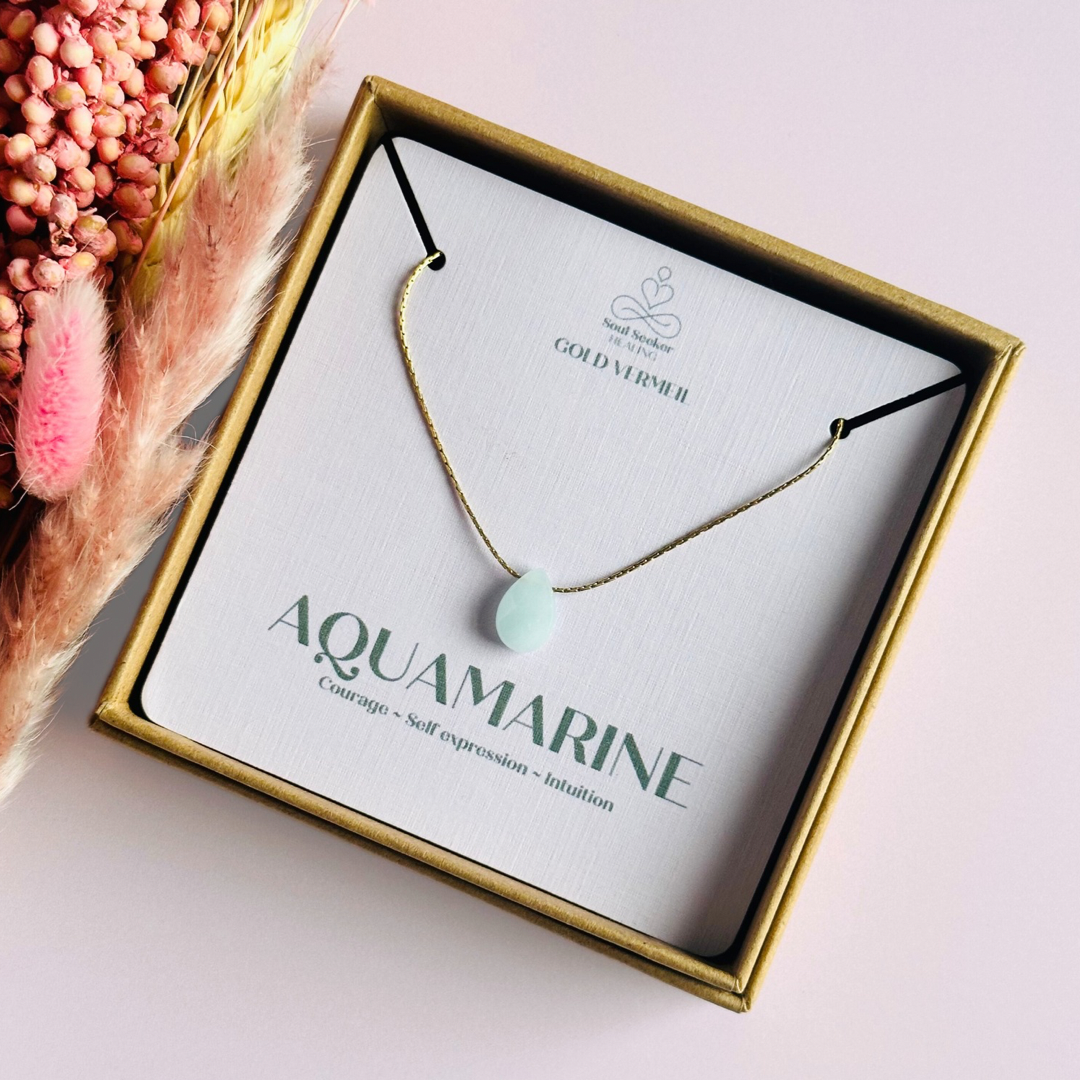 Dainty aquamarine teardrop necklace featuring a 12x8mm faceted aquamarine teardrop bead on a fine gold vermeil cardano beading chain.