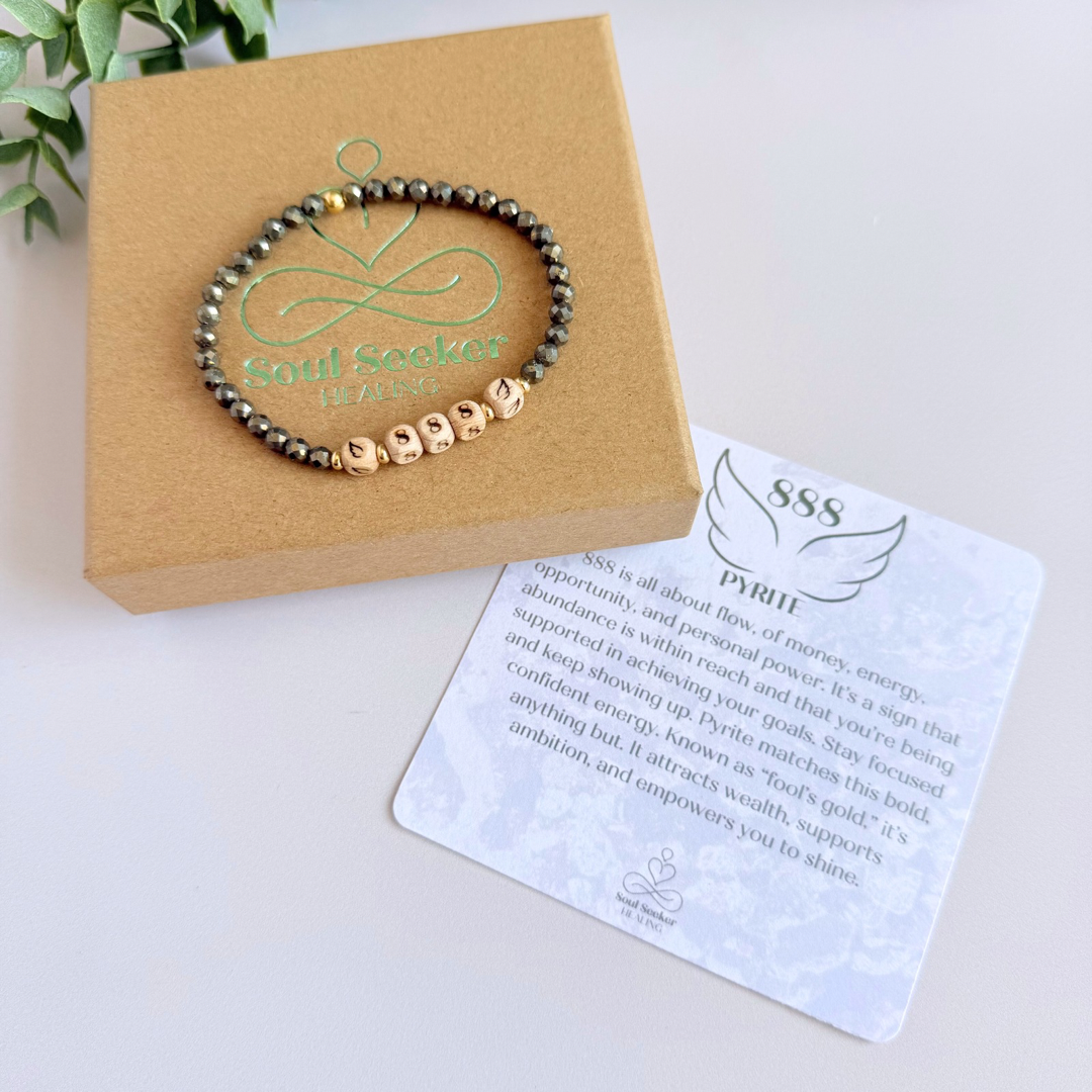 Bracelet featuring engraved wooden 888 angel number and wing beads, on the band of 4mm faceted pyrite round crystal gemstone beads. Finished with your choice of gold vermeil, sterling silver or rose gold vermeil accent beads.