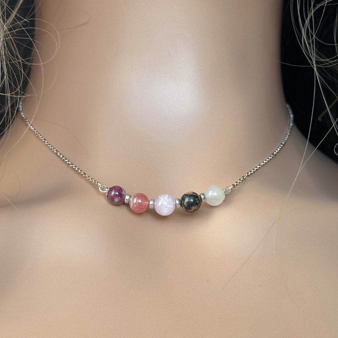 A dainty self love crystal necklace made with a selection of five healing crystals all believed to help promote self love. On a fine, sterling silver figaro chain, which fastens with a sterling silver bolt clasp. Featuring corrugated sterling silver spacer beads and accented with daisy shaped bead caps.