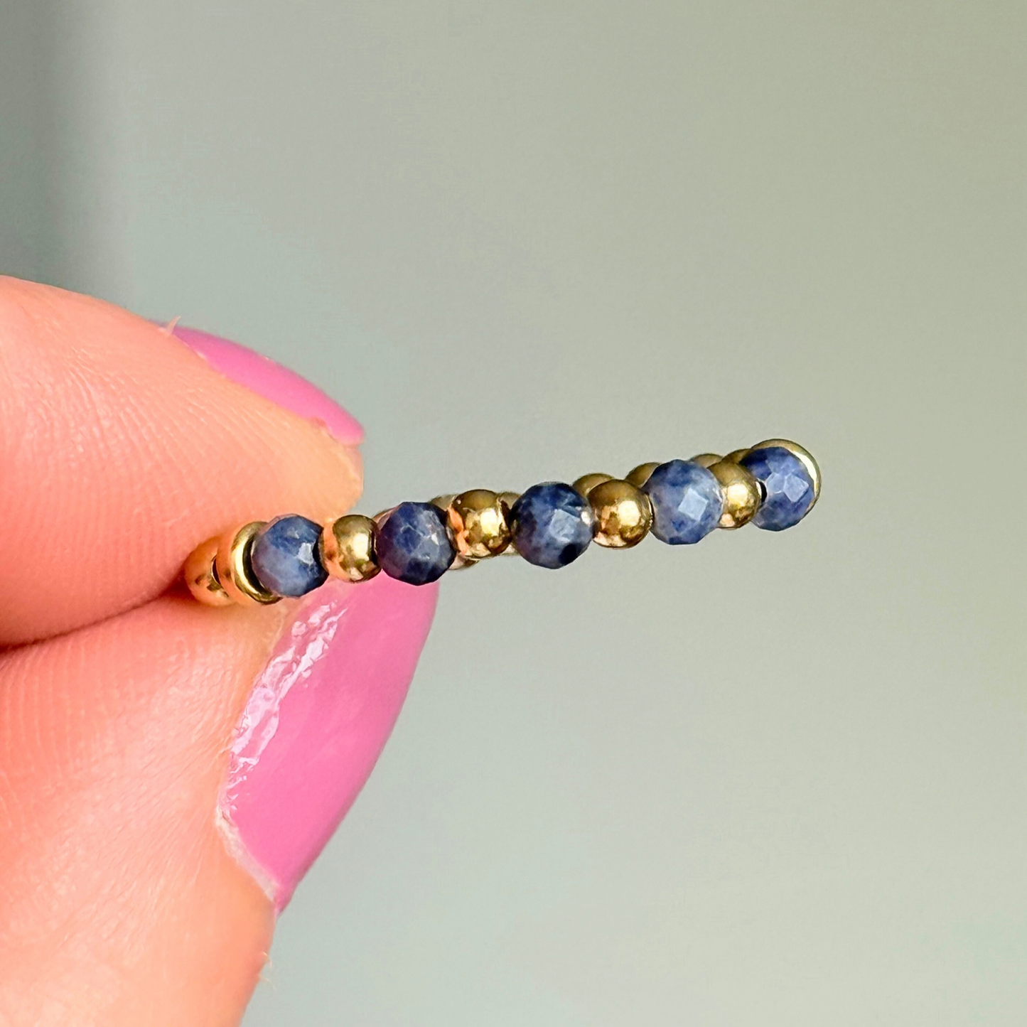 Gold vermeil and sapphire crystal ring. Made with 2.5mm gold vermeil round beads and featuring five, 3mm faceted genuine sapphire beads in a band style. Perfect for stacking. September birthstone jewellery