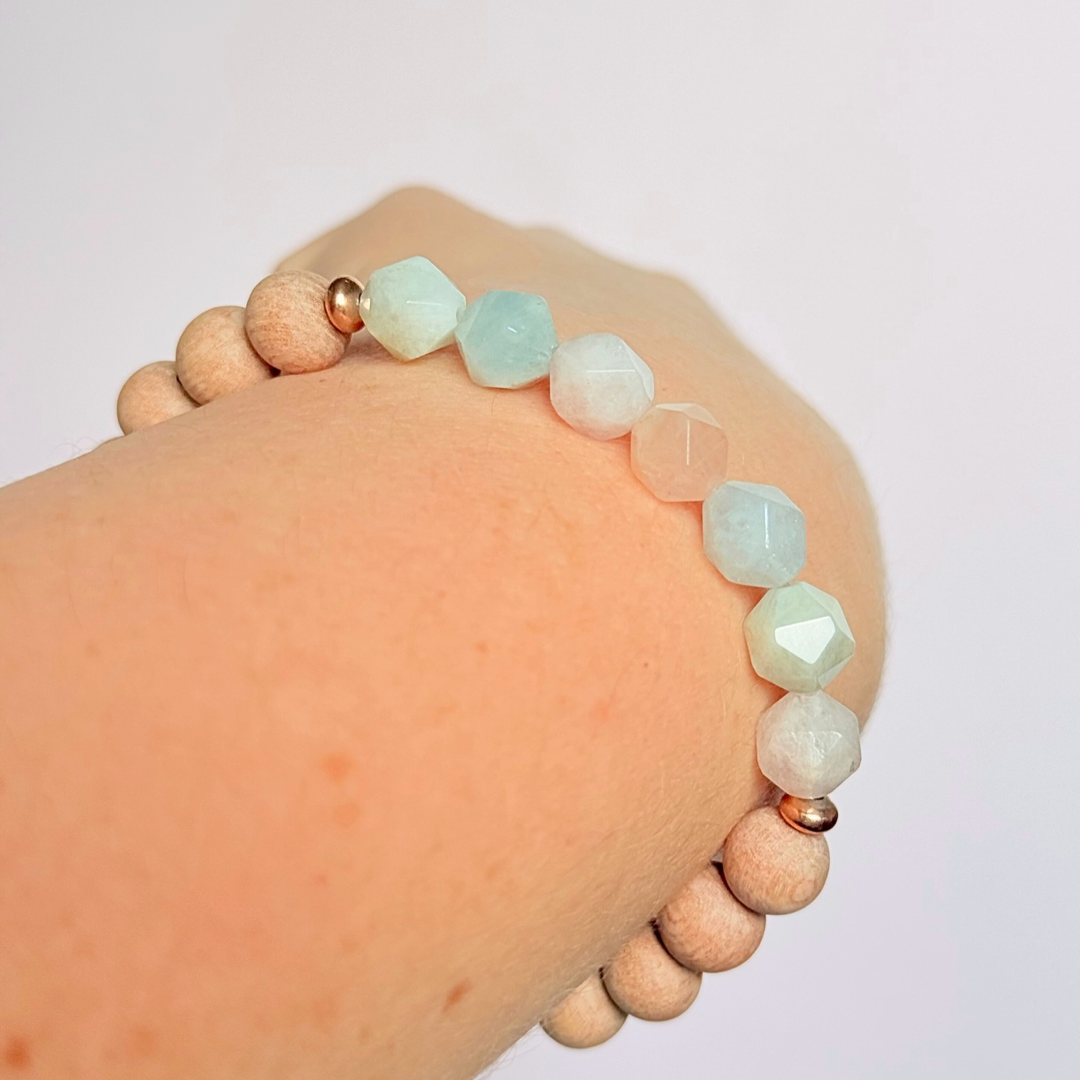 Morganite and raw rosewood elasticated essential oil diffuser bracelet. Made with 8mm star cut morganite beads, 8mm round raw rosewood beads and your choice of sterling silver, gold vermeil or rose gold vermeil spacer beads