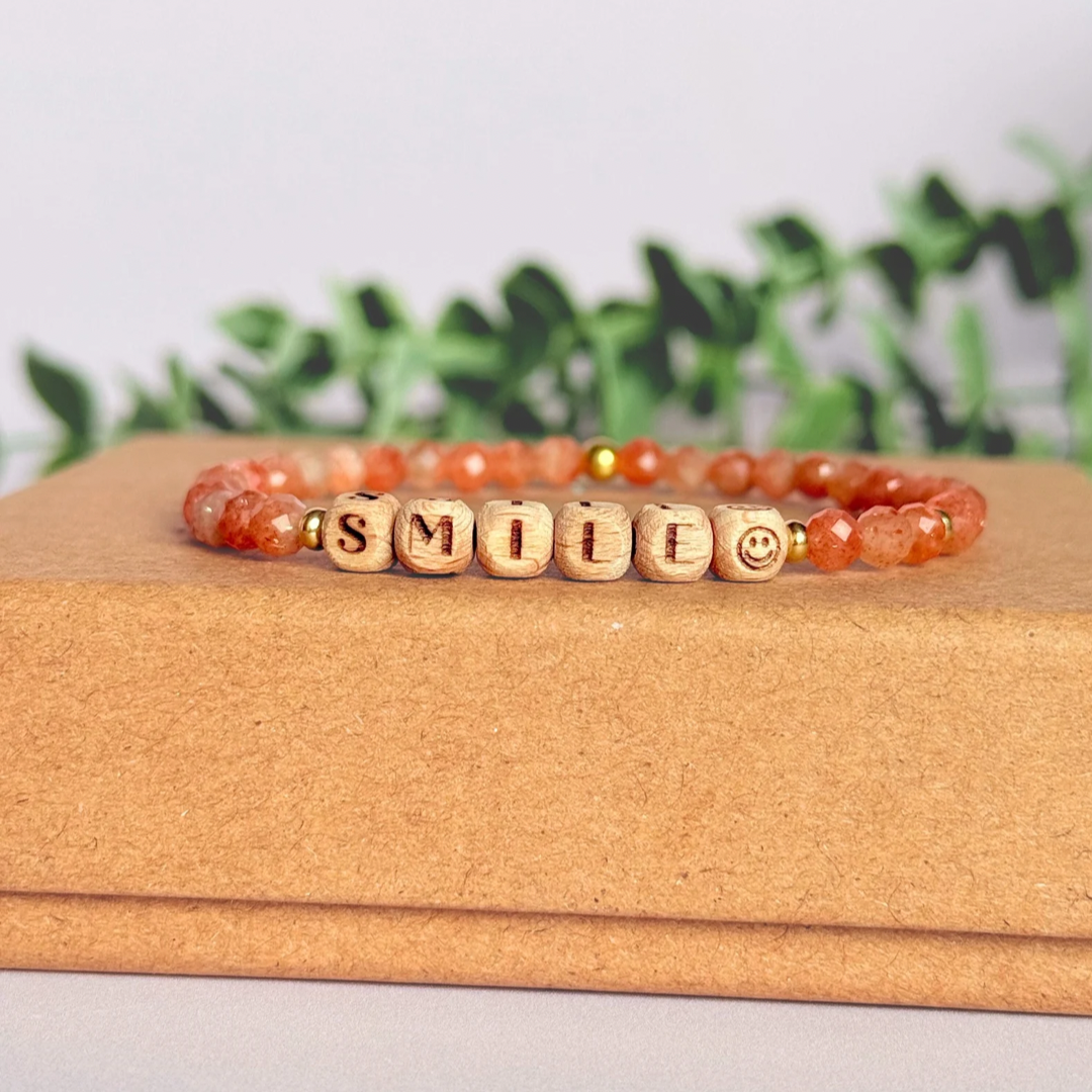 Bracelet featuring 5mm engraved wooden beads which you can personalise with your choice of words, numbers and symbols. The main the band of the bracelet is made with 4mm faceted sunstone round crystal gemstone beads. Finished with your choice of gold vermeil, sterling silver or rose gold vermeil accent beads.