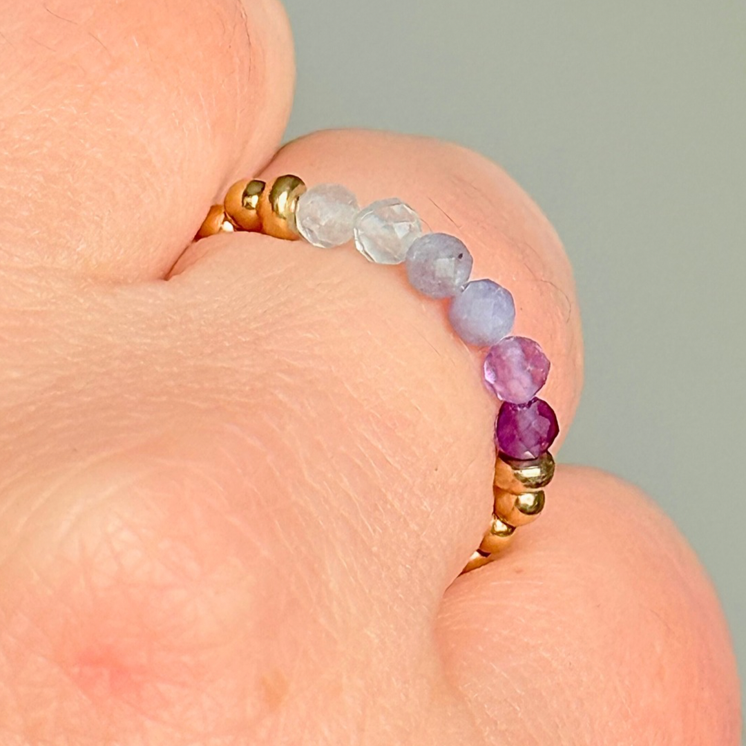 Gold filled band style ombré ring with multicolour 3mm faceted amethyst tanzanite and aquamarine, beads with a beaded band of 2.5 mm gold filled round beads. Elasticated for comfort.