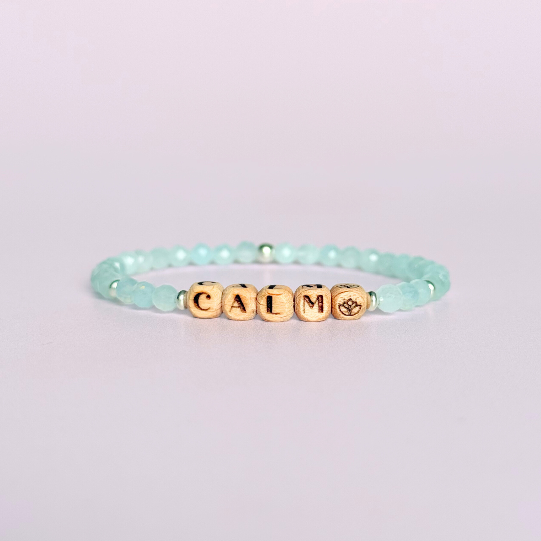 Bracelet featuring 5mm engraved wooden beads which you can personalise with your choice of words, numbers and symbols. The main the band of the bracelet is made with 4mm faceted aquamarine round crystal gemstone beads. Finished with your choice of gold vermeil, sterling silver or rose gold vermeil accent beads.