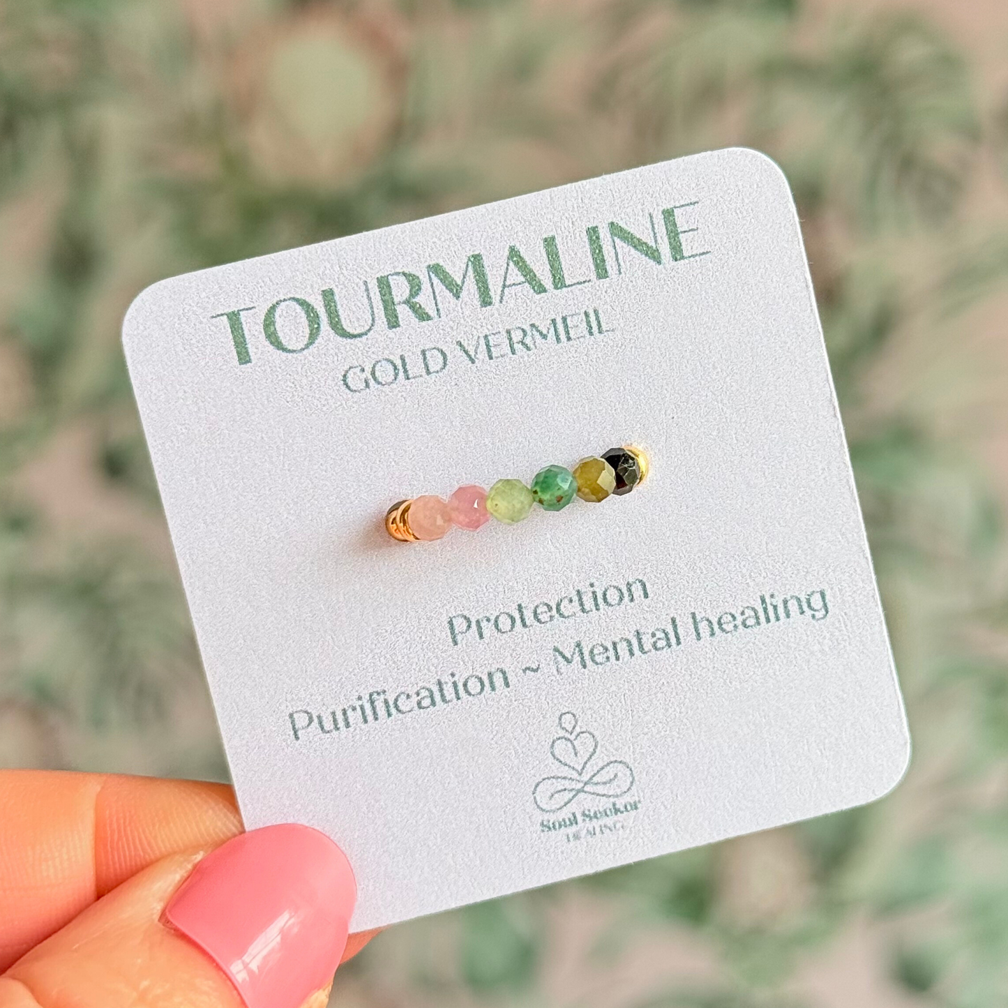 Gold vermeil band style ring with multicolour 3mm faceted mixed tourmaline beads in shades of pink, green and black, with a beaded band of 2.5 mm gold vermeil round beads. Elasticated for comfort.