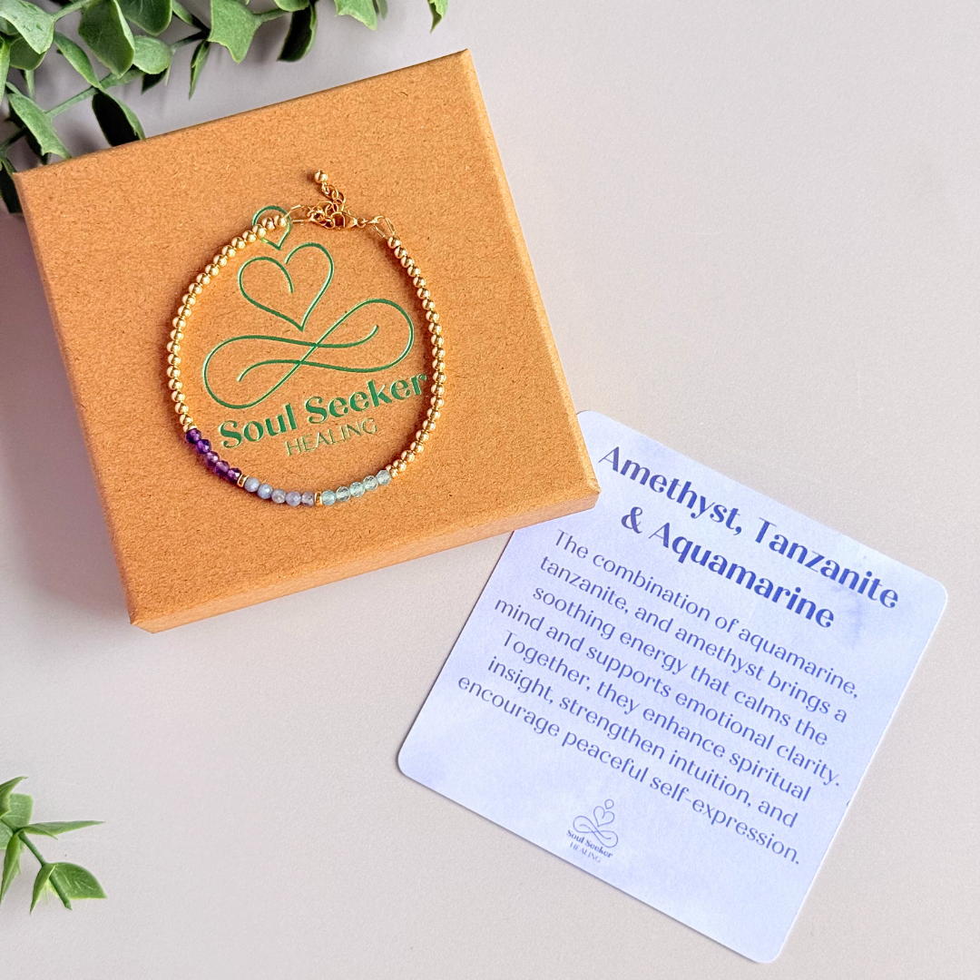 Dainty minimalist yellow gold filled crystal bracelet featuring 3mm faceted amethyst, aquamarine and tanzanite beads in a colour block Ombre style. Fastens with a gold filled lobster clasp with an extender chain.