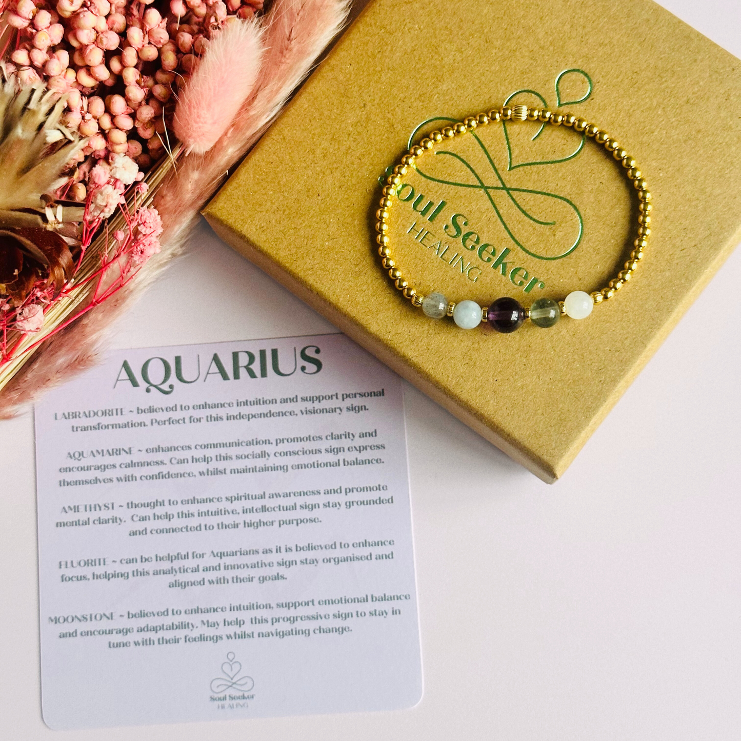 This gold vermeil Aquarius bracelet is made with a selection of five healing crystals all believed to resonate with the Aquarius zodiac sign. The central bead is 8mm, the other four are 6mm. On an elasticated band of 3mm gold vermeil beads with corrugated accent beads. Featuring labradorite, moonstone, fluorite, amethyst and aquamarine.
