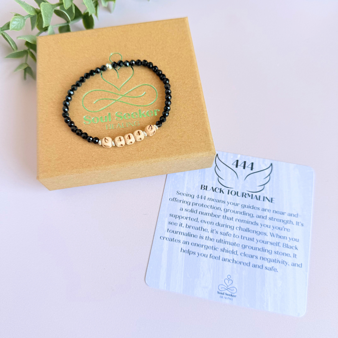 Bracelet featuring engraved wooden 444 angel number and wing beads, on the band of 4mm faceted black tourmaline round crystal gemstone beads. Finished with your choice of gold vermeil, sterling silver or rose gold vermeil accent beads.