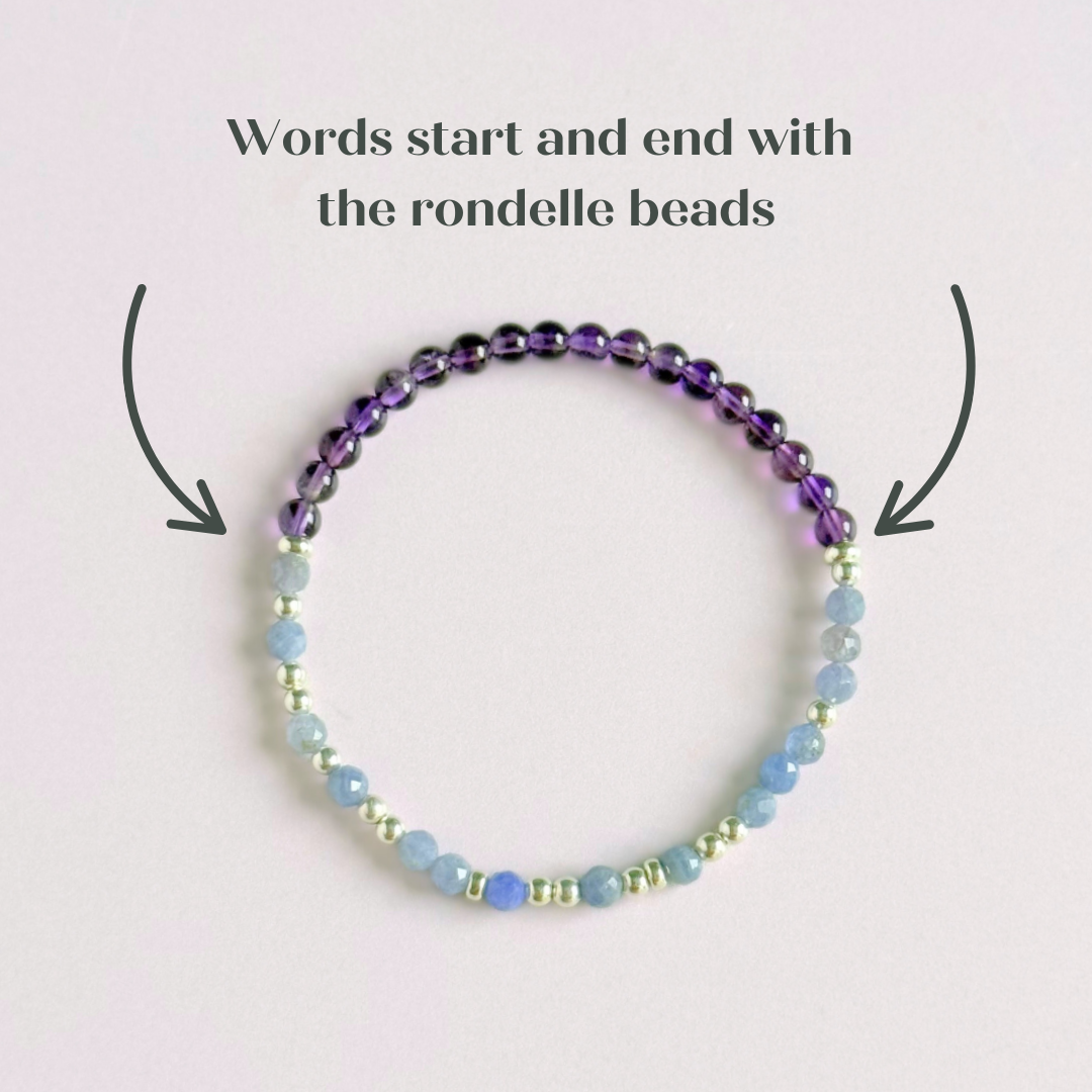 Amethyst and tanzanite elasticated stretch crystal morse code bracelet that spells out the words ‘Calm TF down’ in a combination of 4mm round amethyst beads, 4mm faceted tanzanite beads and either sterling silver or gold vermeil 3mm round beads. The words start and end at the rondelle spacer beads.
