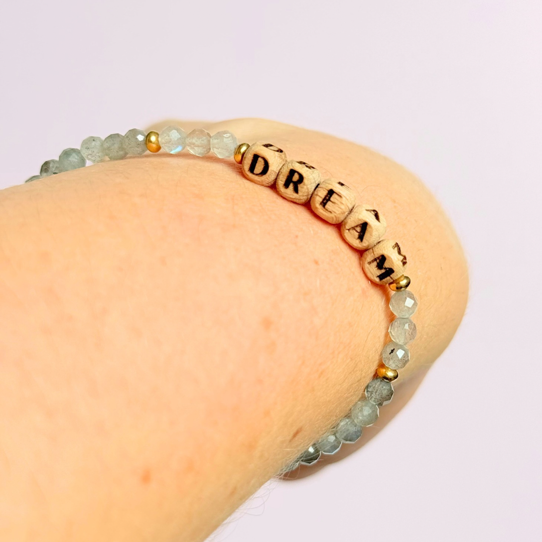 Bracelet featuring 5mm engraved wooden beads, which you can personalise with your choice of words, numbers and symbols. The main the band of the bracelet is made with 4mm faceted labradorite round crystal gemstone beads. Finished with your choice of gold vermeil, sterling silver or rose gold vermeil accent beads.