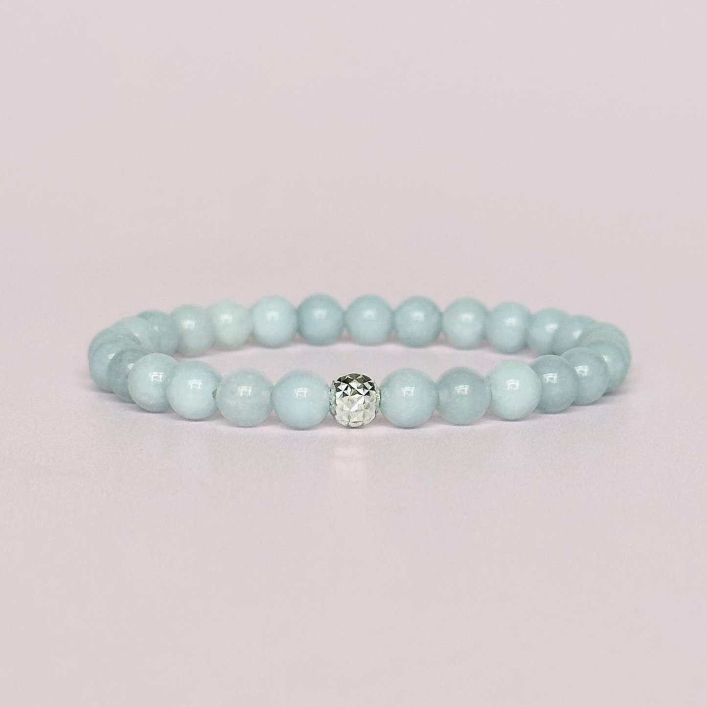Aquamarine bracelet with a faceted sterling silver or gold vermeil focal bead. A bracelet for eternal youth. Made with 6mm beads.