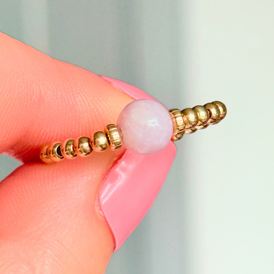 Crystal ring with a 6mm kunzite round bead on an elasticated ring band of 2.5mm gold vermeil ball beads.