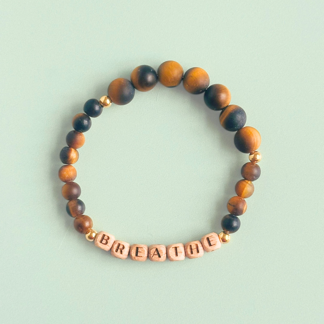 Breathwork bracelet featuring 6mm and 8mm frosted tigers eye crystal beads that follow the 4-7-8 counted breathing method. Also featuring laser engraved wooden letter beads spelling out the word BREATHE. Choose your accent beads from rose gold vermeil, gold vermeil or sterling silver.