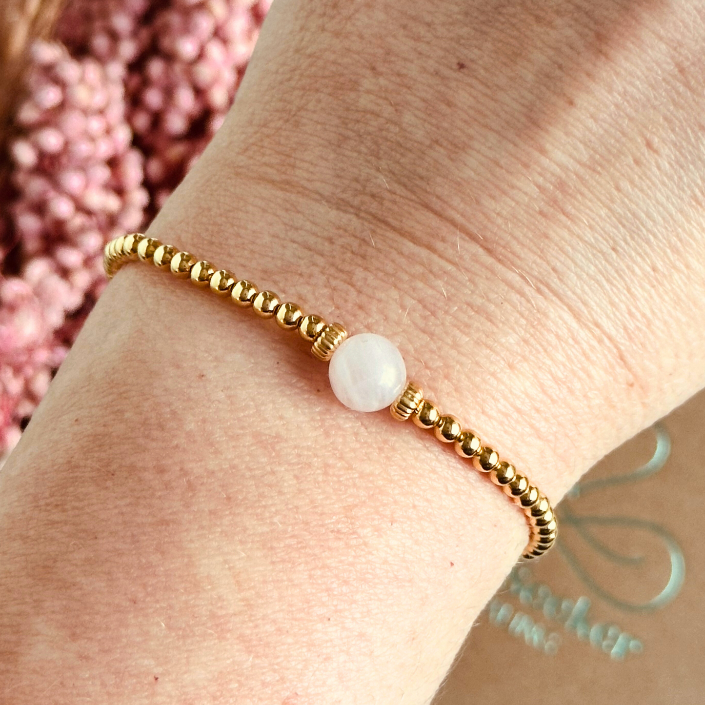 Gold vermeil rose quartz bracelet features an ethically mined 8mm rose quartz bead, flanked by corrugated rondelle beads on a band of 3mm gold vermeil beads. A bracelet to promote self love and self-confidence.