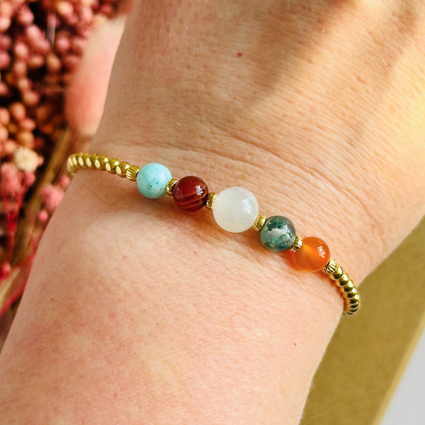 This gold vermeil Virgo bracelet is made with a selection of five healing crystals all believed to resonate with the Virgo zodiac sign. The central bead is 8mm, the other four are 6mm. On an elasticated band of 3mm gold vermeil beads with corrugated accent beads. Featuring amazonite, carnelian, moonstone, moss agate and sardonyx.