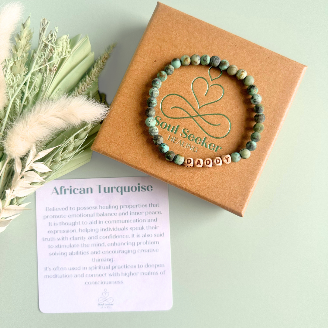 Men’s crystal bracelet with 6mm frosted African turquoise gemstone crystal beads and laser engraved wooden letter beads featuring the words best dad or can also be made with any other words or letters.