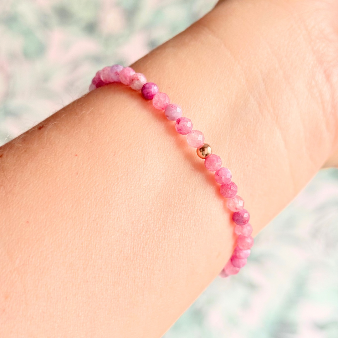 Bracelet featuring 5mm engraved wooden beads which you can personalise with your choice of words, numbers and symbols. The main the band of the bracelet is made with 4mm faceted pink tourmaline round crystal gemstone beads. Finished with your choice of gold vermeil, sterling silver or rose gold vermeil accent beads.
