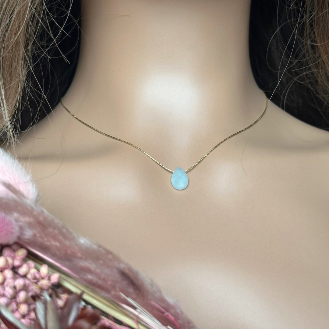 Dainty aquamarine teardrop necklace featuring a 12x8mm faceted aquamarine teardrop bead on a fine gold vermeil cardano beading chain.