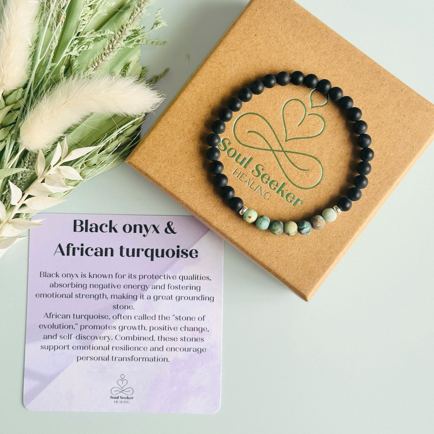 Men’s crystal bracelet featuring 6mm matte black onyx beads, 6mm matte African turquoise beads with sterling silver spacer beads.