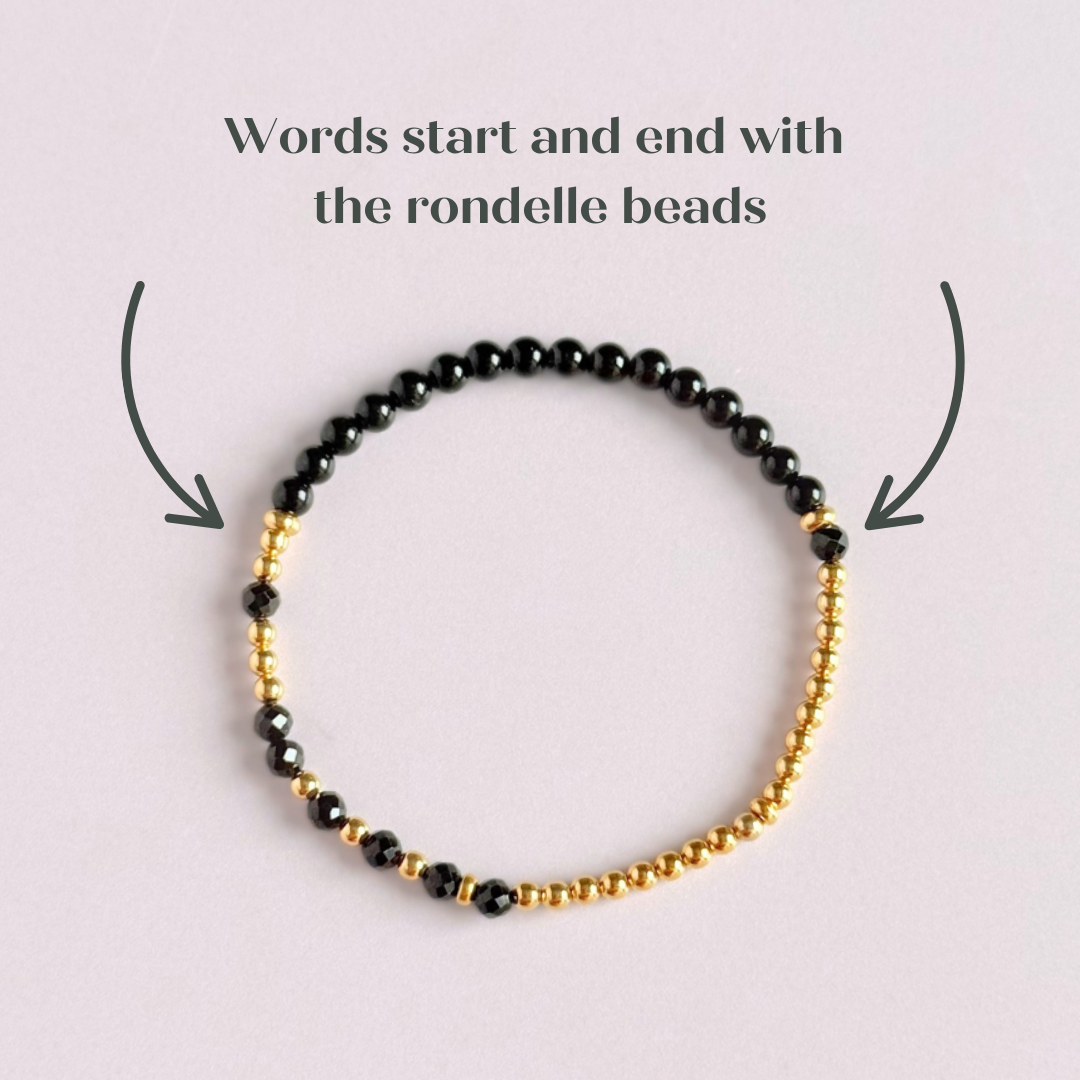 Elasticated black tourmaline crystal morse code bracelet spells out the words ‘Fuck this shit’ in a combination of 4mm round black tourmaline beads, 4mm faceted black tourmaline beads and either sterling silver or gold vermeil 3mm round beads. The words start and end at the rondelle spacer beads.