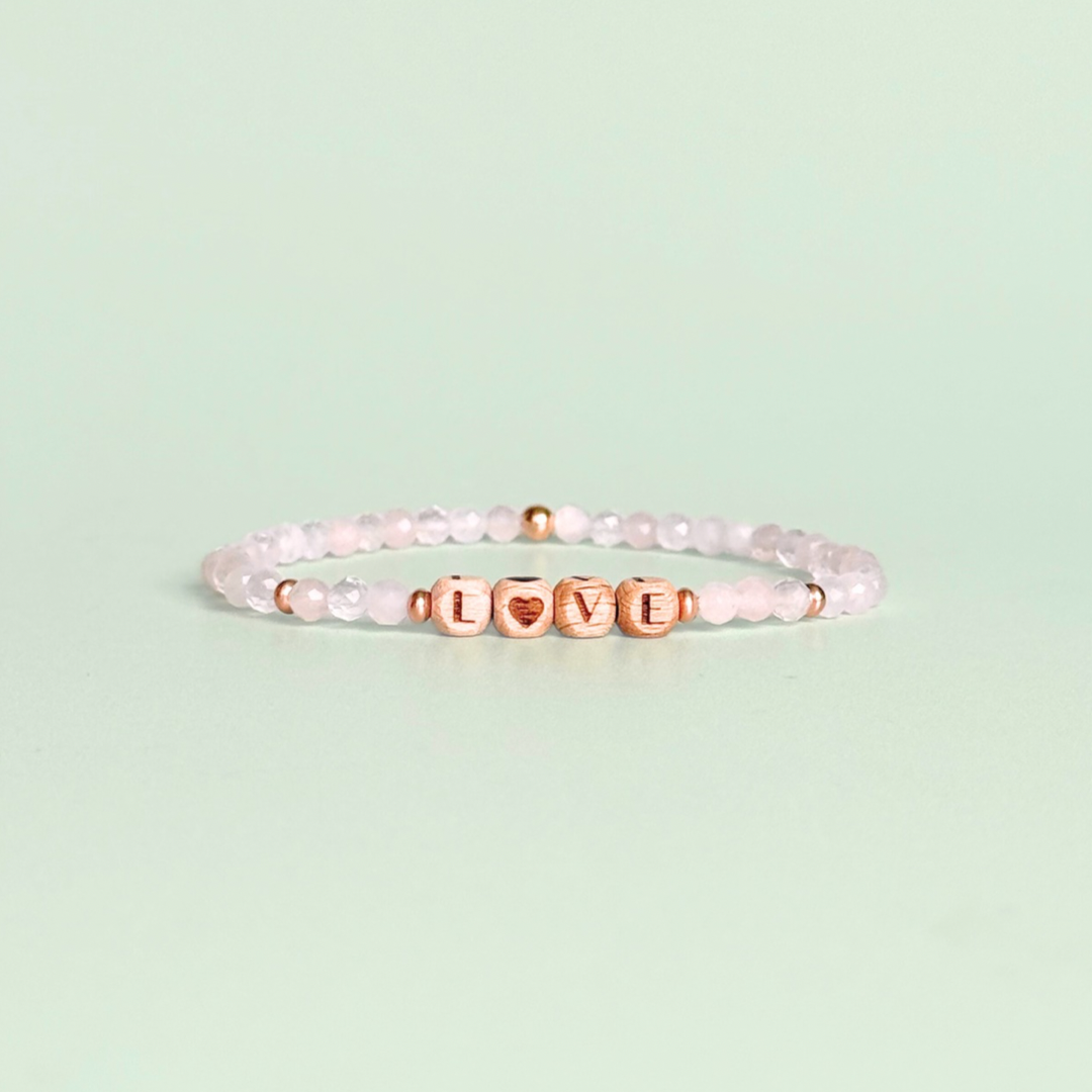 Bracelet featuring 5mm engraved wooden beads which you can personalise with your choice of words, numbers and symbols. The main the band of the bracelet is made with 4mm faceted rose quartz round crystal gemstone beads. Finished with your choice of gold vermeil, sterling silver or rose gold vermeil accent beads.