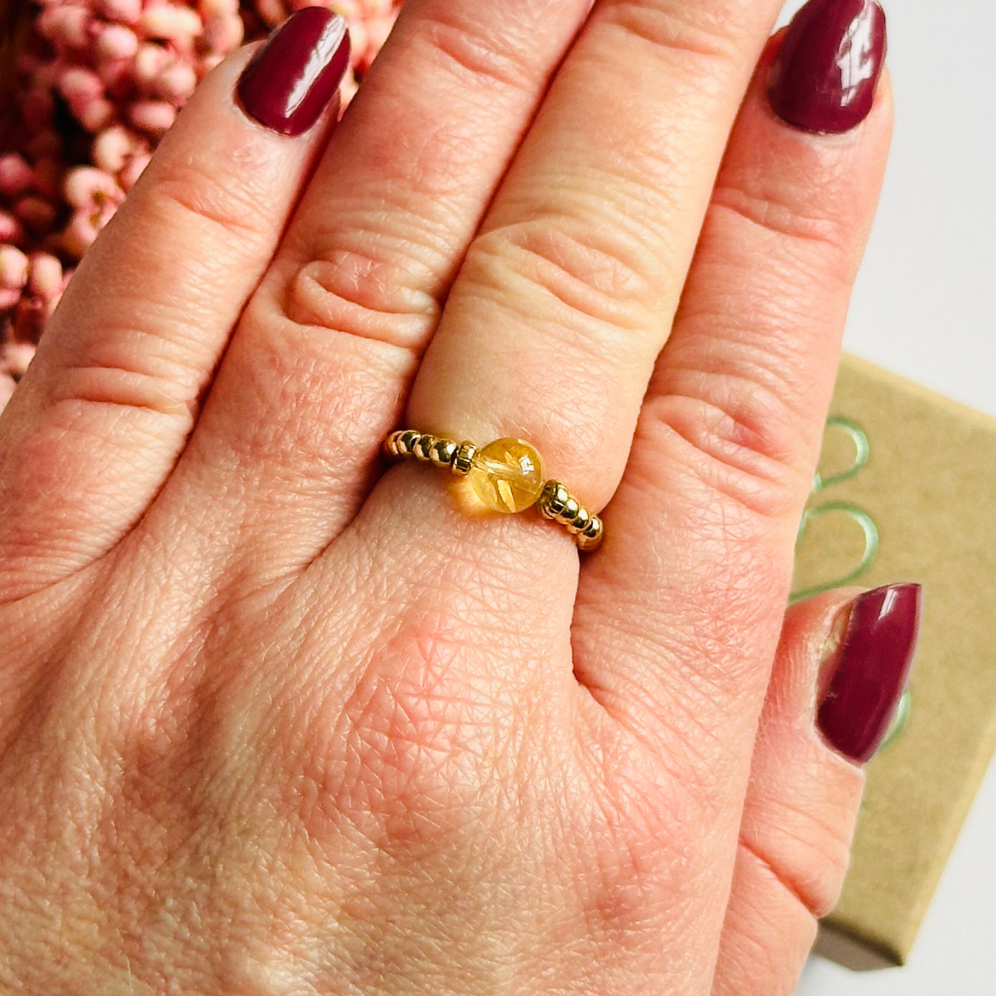 Citrine ring featuring a 6mm round citrine bead, flanked by gold vermeil rondelle beads on a gold vermeil elasticated band. November birthday ideas, November birthday gift, November birthstone ring, stretch ring, November jewellery, born in November