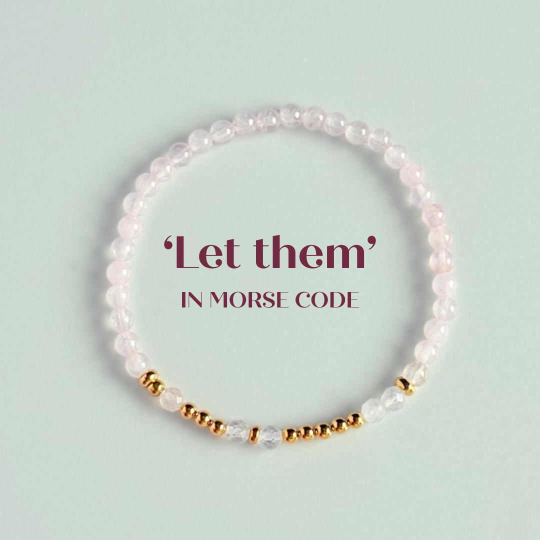 Rose quartz crystal morse code bracelet that spells out the words ‘Let them’ in a combination of 4mm round rose quartz beads, 4mm faceted rose quartz beads and either sterling silver or gold vermeil 3mm round beads. The words start and end at the rondelle spacer beads.
