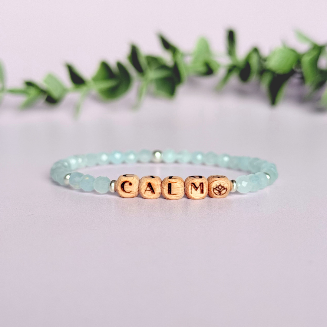 Bracelet featuring 5mm engraved wooden beads which you can personalise with your choice of words, numbers and symbols. The main the band of the bracelet is made with 4mm faceted aquamarine round crystal gemstone beads. Finished with your choice of gold vermeil, sterling silver or rose gold vermeil accent beads.