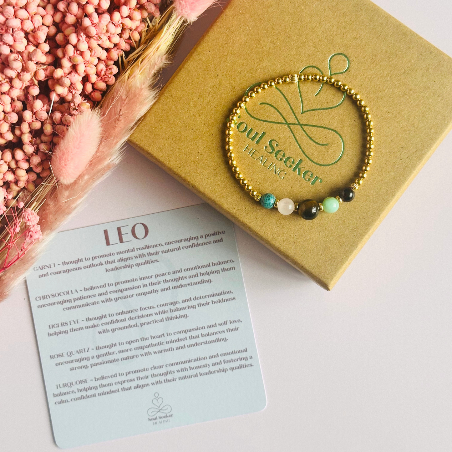 This gold vermeil Leo bracelet is made with a selection of five healing crystals all believed to resonate with the Leo zodiac sign. The central bead is 8mm, the other four are 6mm. On an elasticated band of 3mm gold vermeil beads with corrugated accent beads. Featuring chrysocolla, garnet, tigers eye, rose quartz and turquoise.