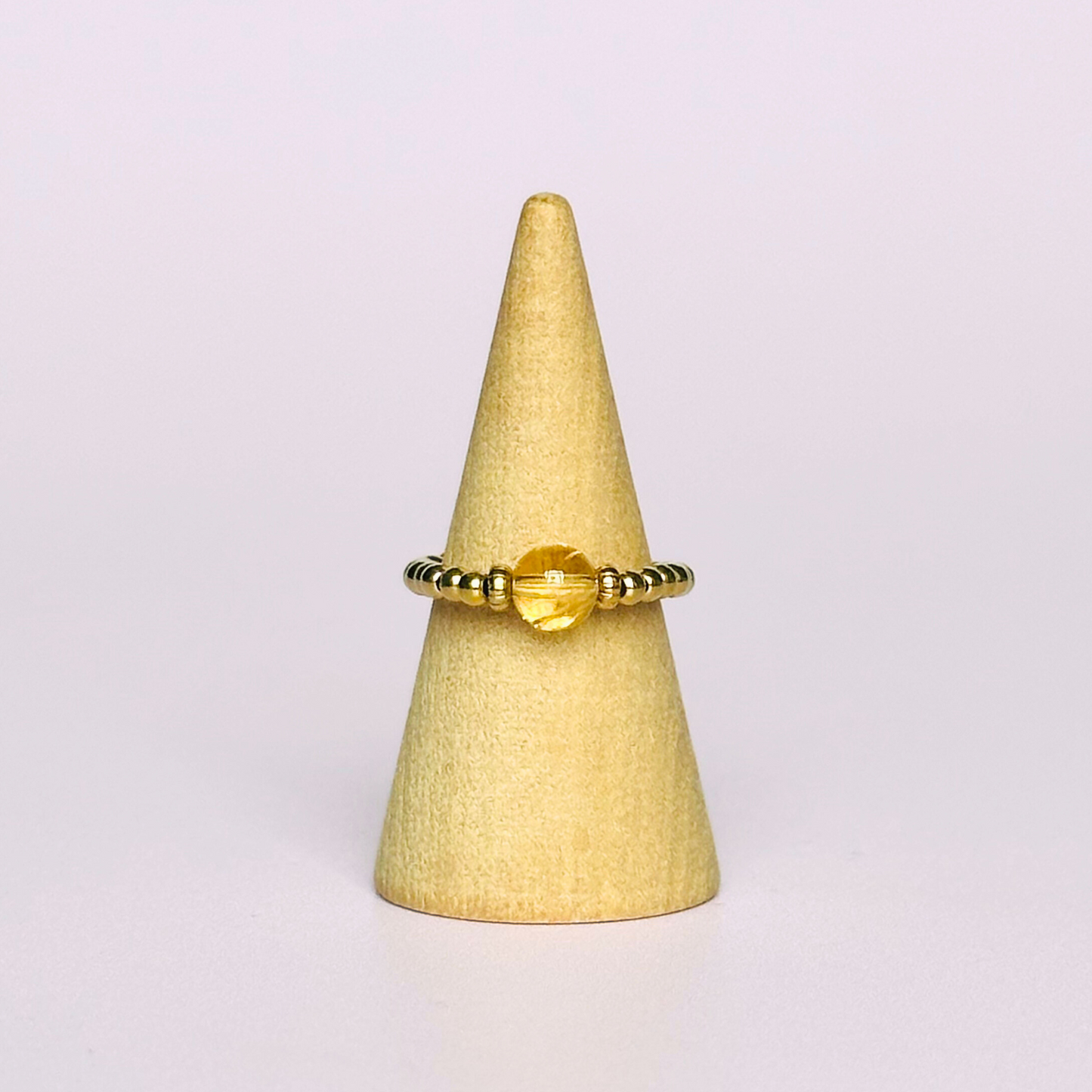 Citrine ring featuring a 6mm round citrine bead, flanked by gold vermeil rondelle beads on a gold vermeil elasticated band. November birthday ideas, November birthday gift, November birthstone ring, stretch ring, November jewellery, born in November
