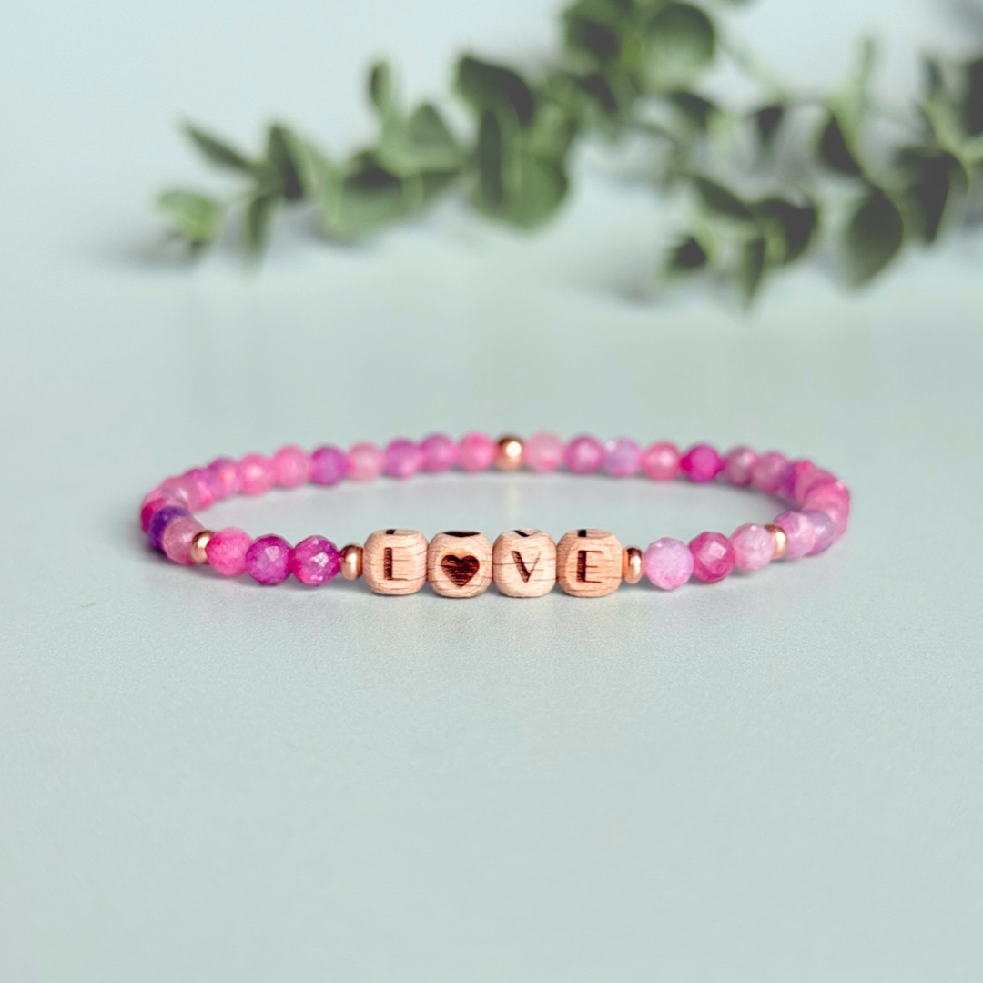 Bracelet featuring 5mm engraved wooden beads which you can personalise with your choice of words, numbers and symbols. The main the band of the bracelet is made with 4mm faceted pink tourmaline round crystal gemstone beads. Finished with your choice of gold vermeil, sterling silver or rose gold vermeil accent beads.