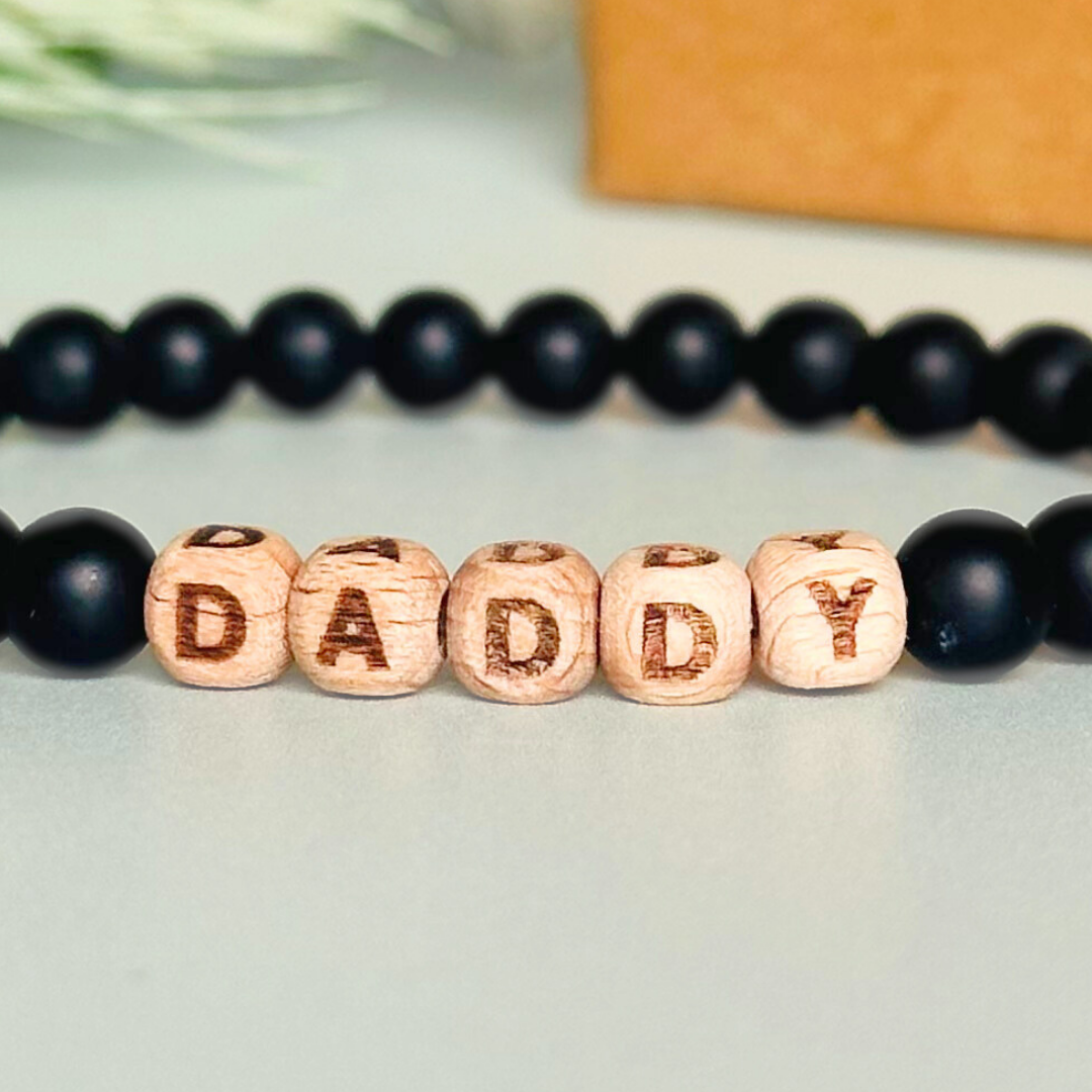 Custom frosted black onyx and wooden letter bead men’s crystal bracelet
