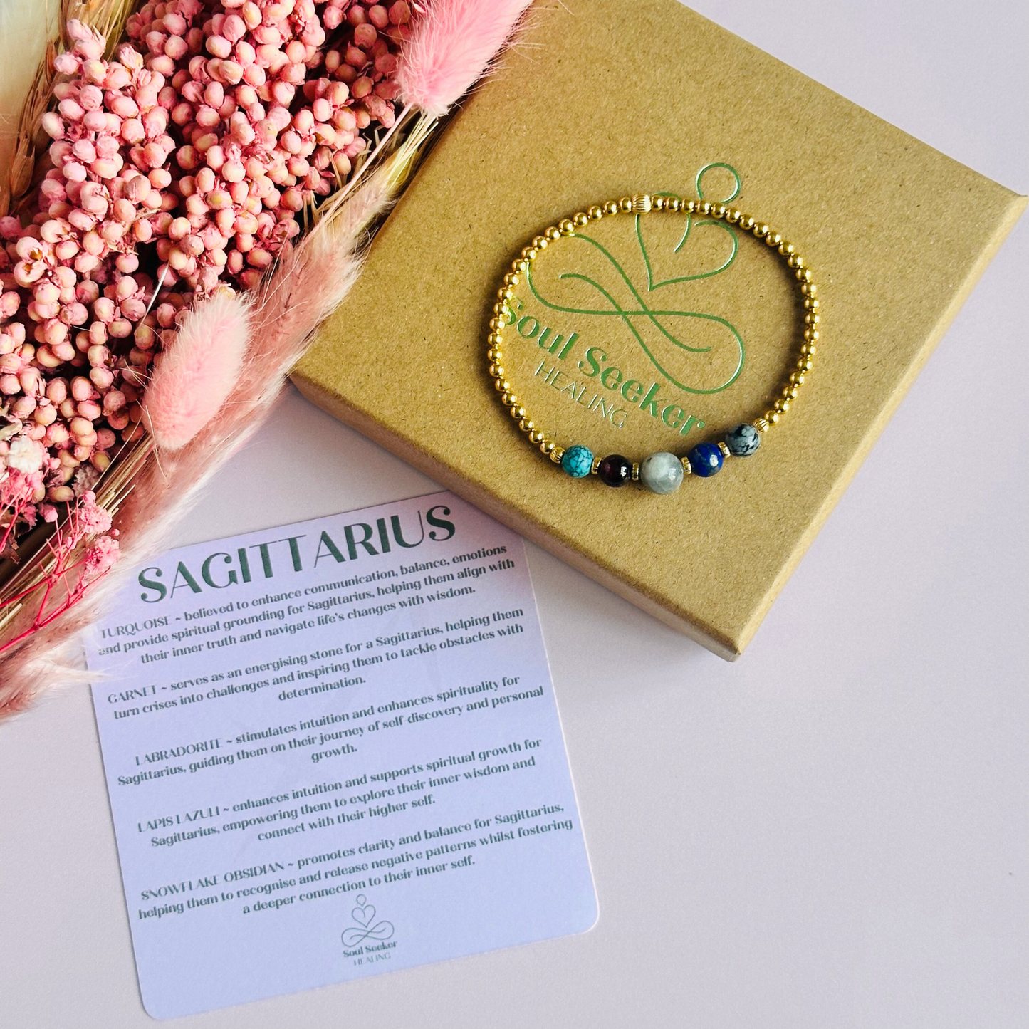 This gold vermeil Sagittarius bracelet is made with a selection of five healing crystals all believed to resonate with the Sagittarius zodiac sign. The central bead is 8mm, the other four are 6mm. On an elasticated band of 3mm gold vermeil beads with corrugated accent beads. Featuring garnet, labradorite, lapis lazuli, snowflake obsidian and turquoise.