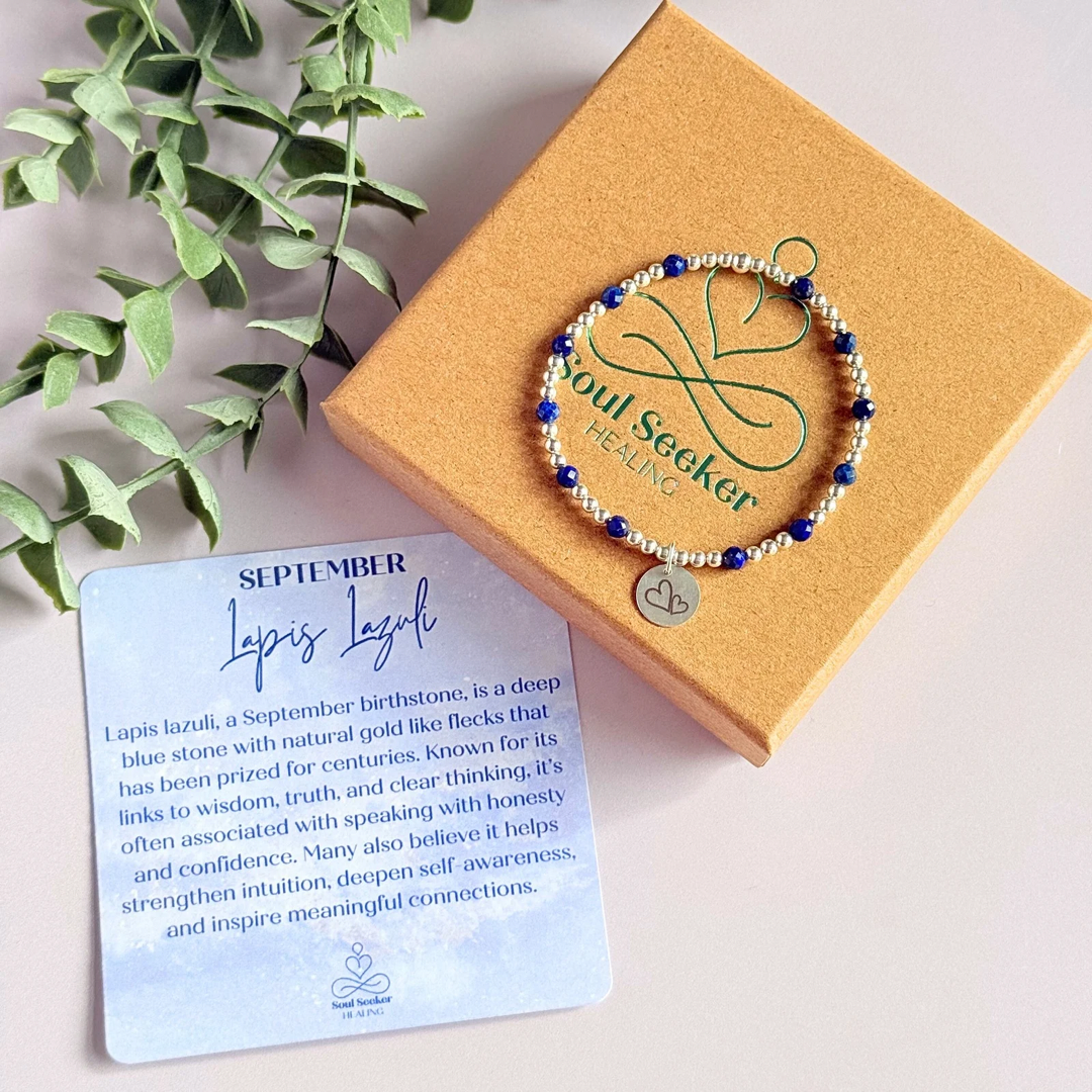 Sterling silver bracelet features 4mm lapis lazuli faceted beads, separated by 3mm sterling silver round beads. Lapis lazuli is a September birthstone. The focal point is an 11mm sterling silver charm, engraved with a large and smaller heart design. This charm can be personalised on one side if required or feature the same graphic on both sides.