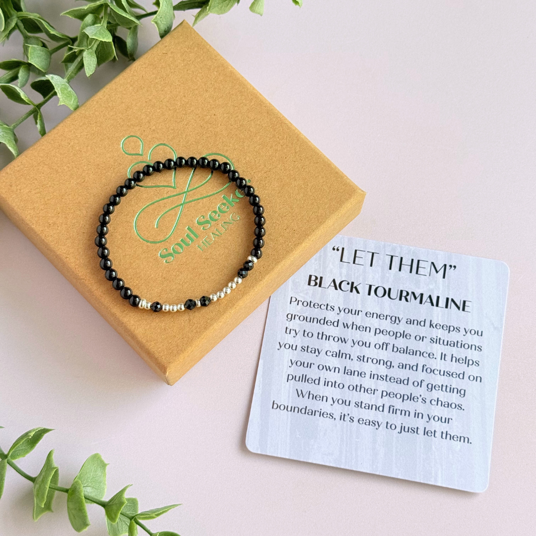 Black tourmaline crystal morse code bracelet that spells out the words ‘Let them’ in a combination of 4mm round black tourmaline beads, 4mm faceted black tourmaline beads and either sterling silver or gold vermeil 3mm round beads. The words start and end at the rondelle spacer beads.