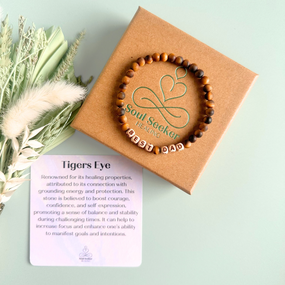 Men’s crystal bracelet with 6mm frosted tigers eye gemstone crystal beads and laser engraved wooden letter beads featuring the words best dad or can also be made with any other words or letters.