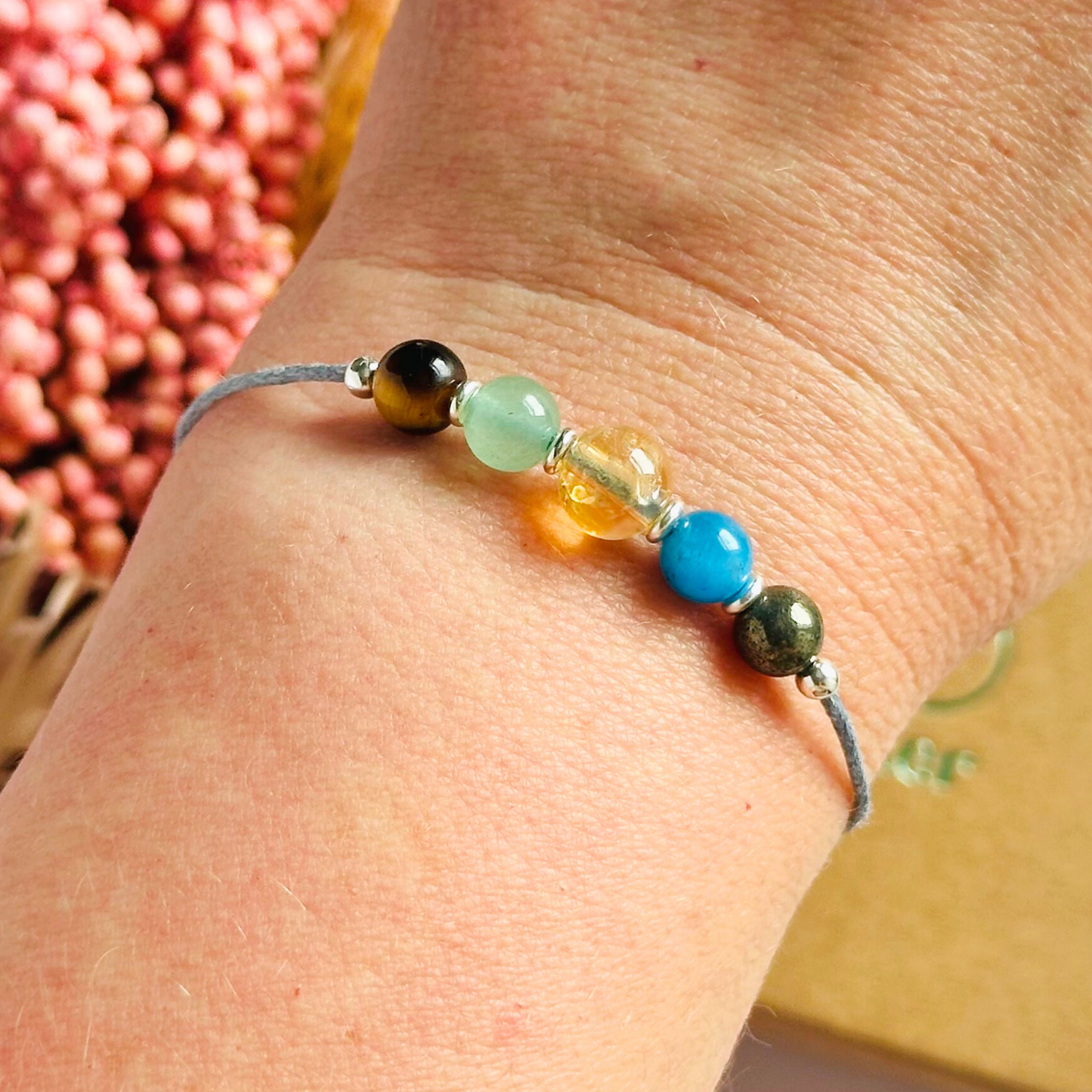 Manifesting crystal healing bracelet made with the tigers eye, green aventurine, citrine, apatite and pyrite. Strung on an eco and vegan friendly waxed cotton cord and finished with your choice of sterling silver, rose gold vermeil or gold vermeil accent beads. A sliding macramé clasp makes it adjustable.