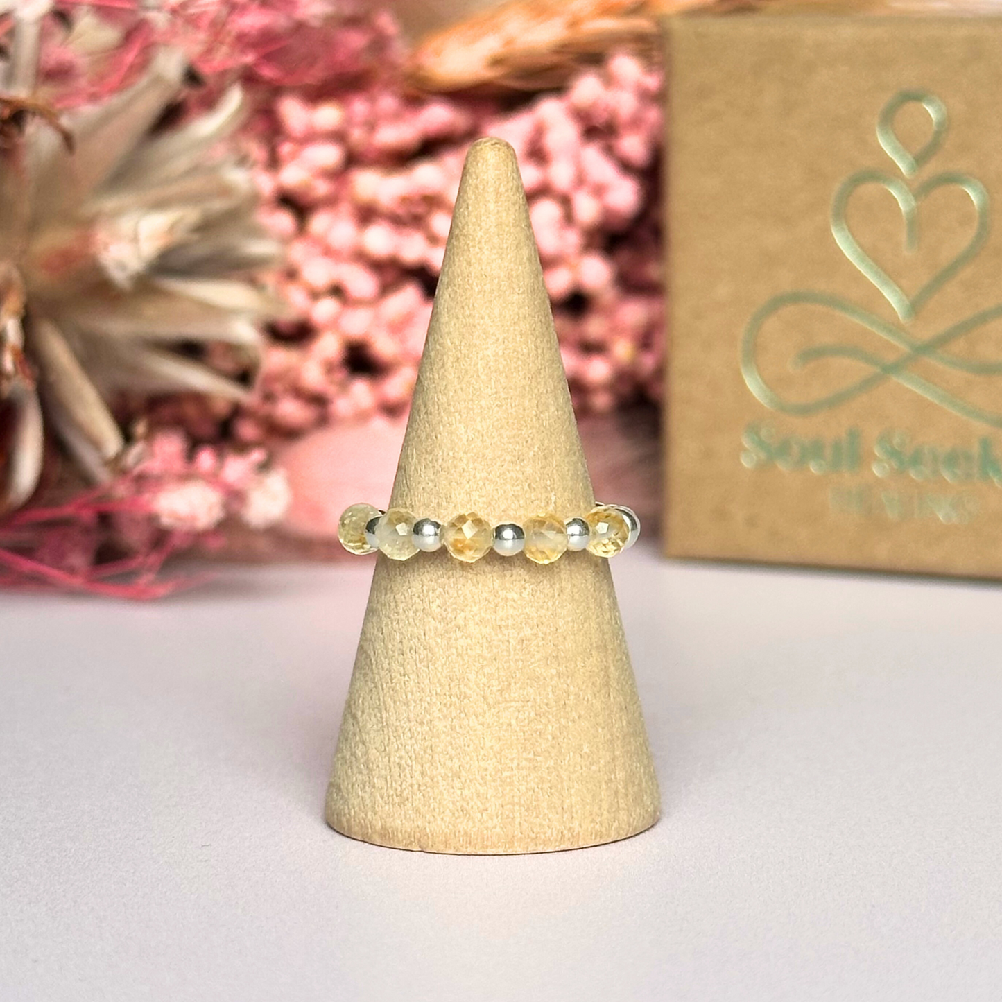 Citrine ring featuring five faceted 3mm citrine beads on a sterling silver elasticated band. November birthday ideas, November birthday gift, November birthstone ring, stretch ring, November jewellery, born in November, November woman